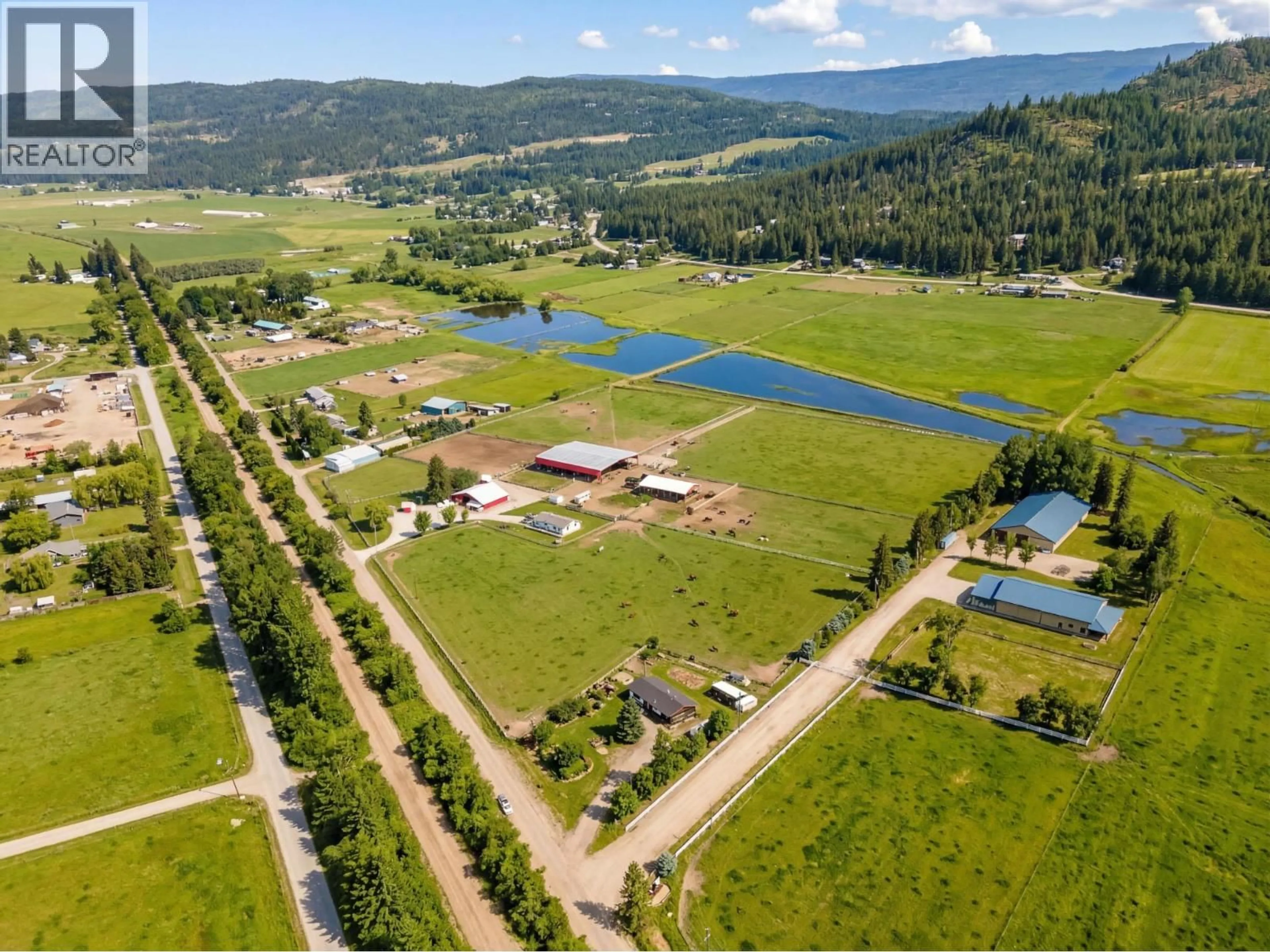 A pic from outside/outdoor area/front of a property/back of a property/a pic from drone, water/lake/river/ocean view for 56 TOMKINSON ROAD, Grindrod British Columbia V0E1Y0