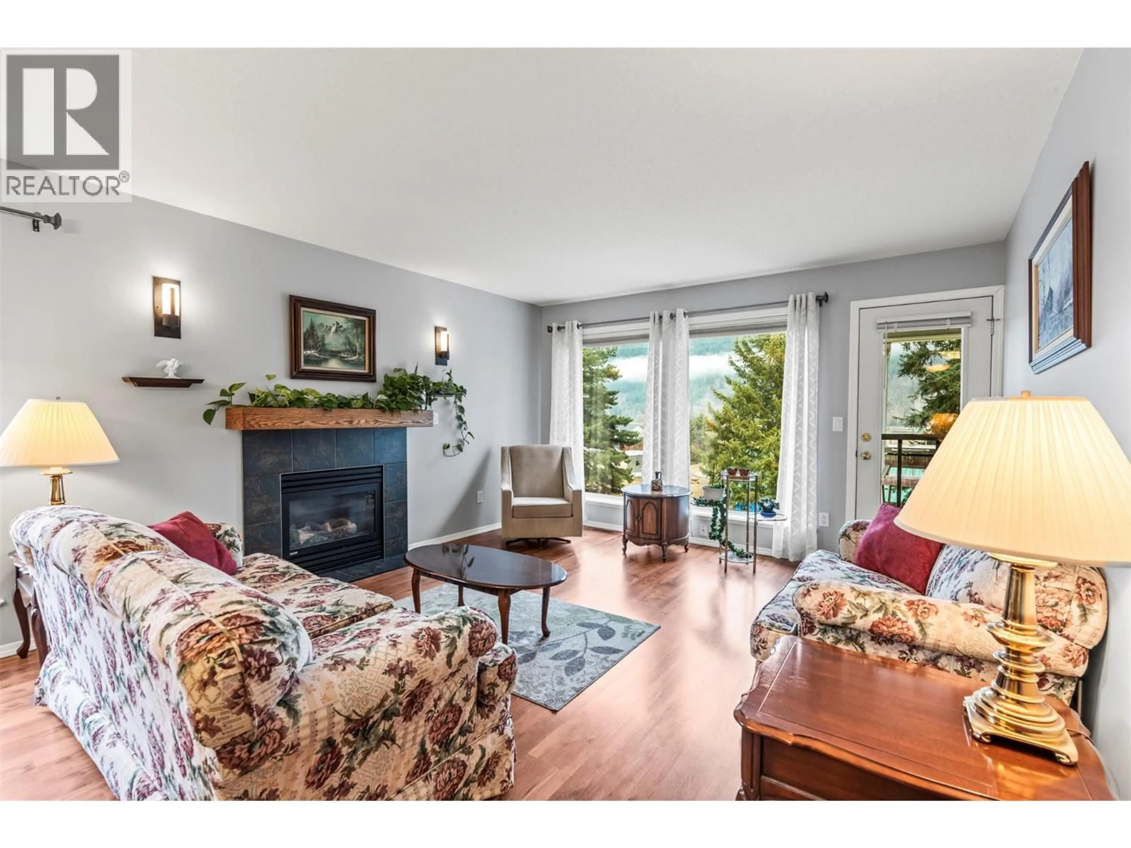 Living room with furniture, wood/laminate floor for 54 - 2675 PINE AVENUE, Lumby British Columbia V0E2G5