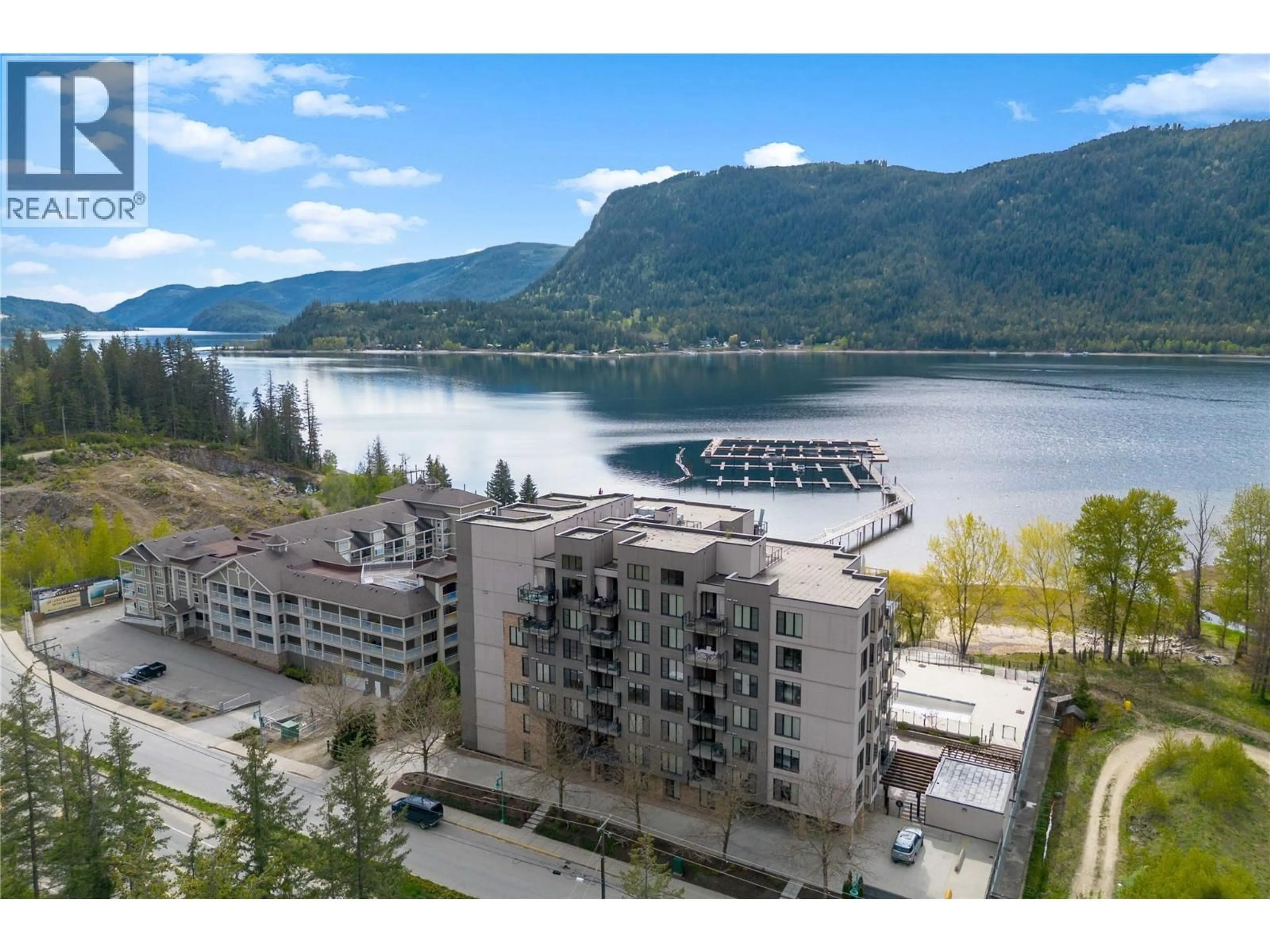 A pic from outside/outdoor area/front of a property/back of a property/a pic from drone, water/lake/river/ocean view for 408 - 326 MARA LAKE LANE, Sicamous British Columbia V0E2V1