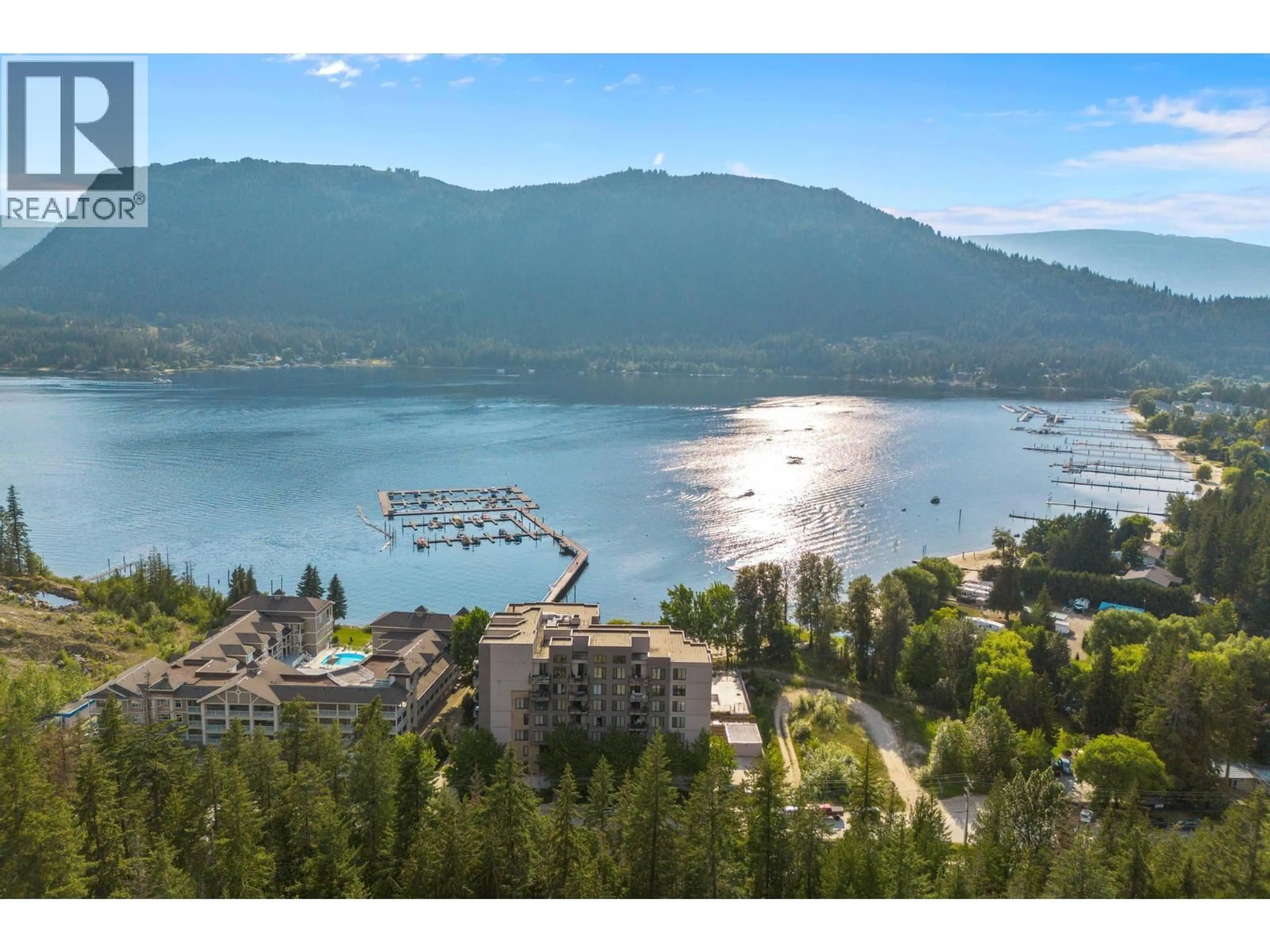 A pic from outside/outdoor area/front of a property/back of a property/a pic from drone, water/lake/river/ocean view for 408 - 326 MARA LAKE LANE, Sicamous British Columbia V0E2V1