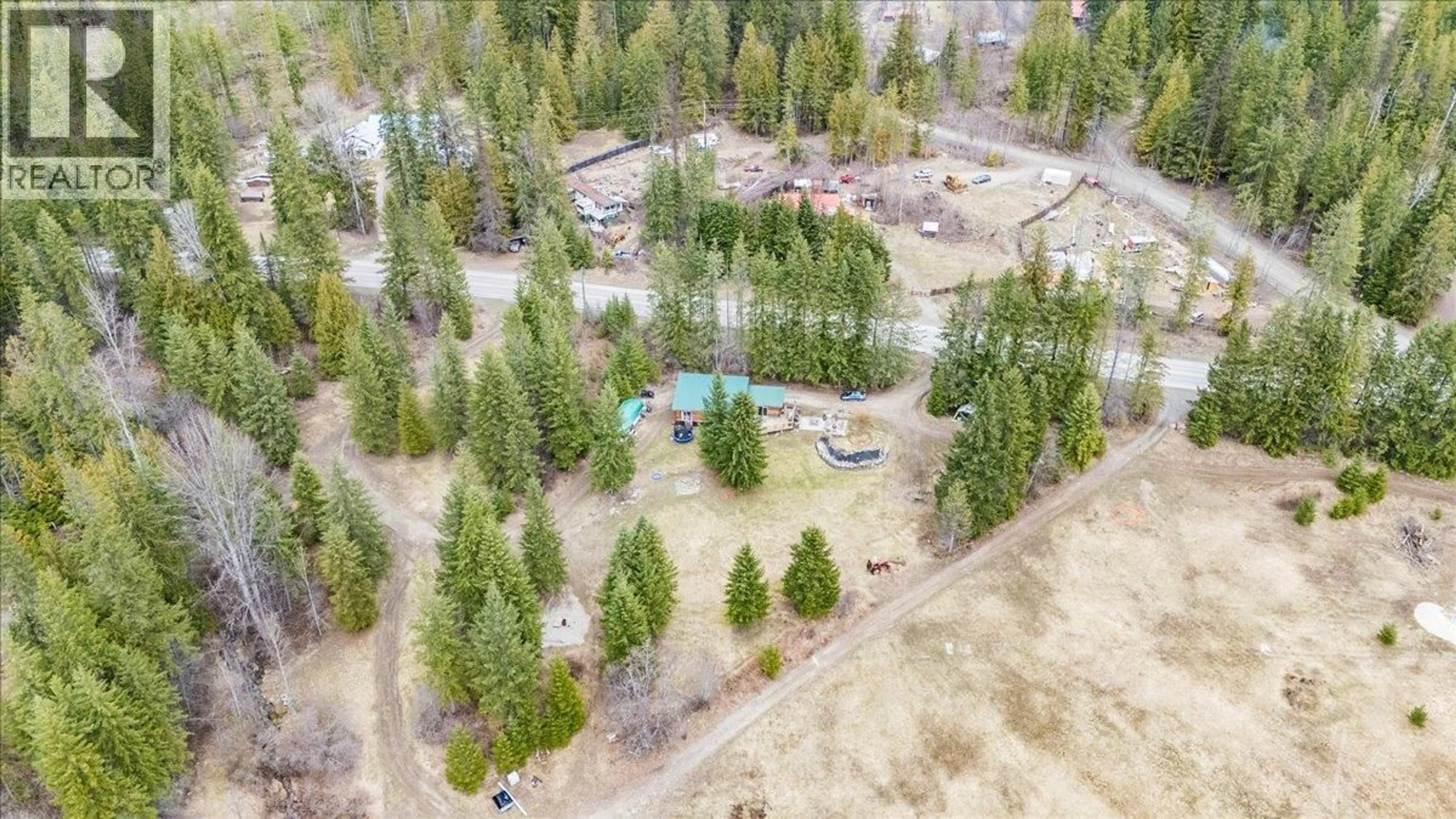 A pic from outside/outdoor area/front of a property/back of a property/a pic from drone, forest/trees view for 4675 6 HIGHWAY, Hills British Columbia V0G1S0