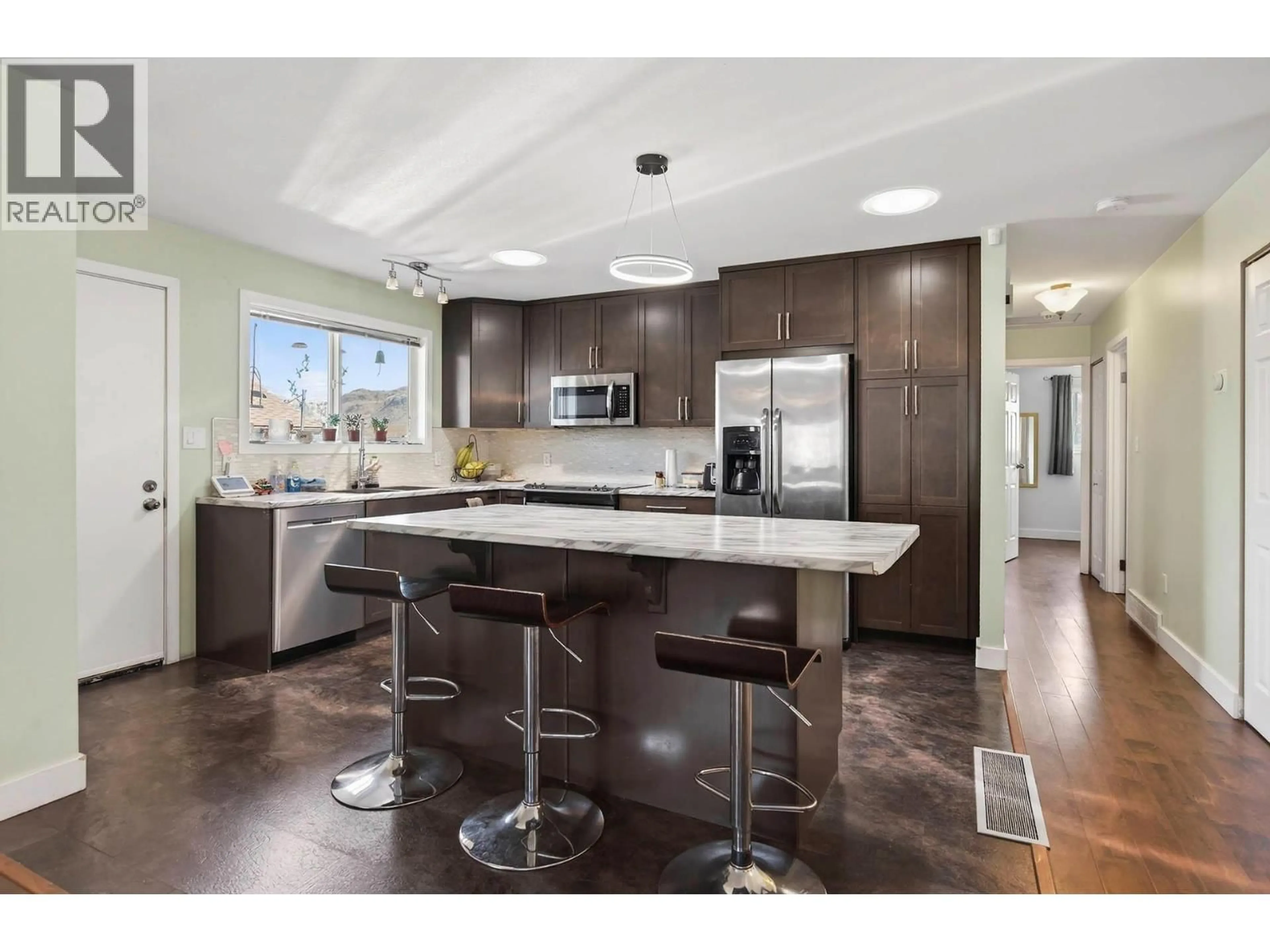 Open concept kitchen, wood/laminate floor for 562 PINE STREET, Ashcroft British Columbia V0K1A0