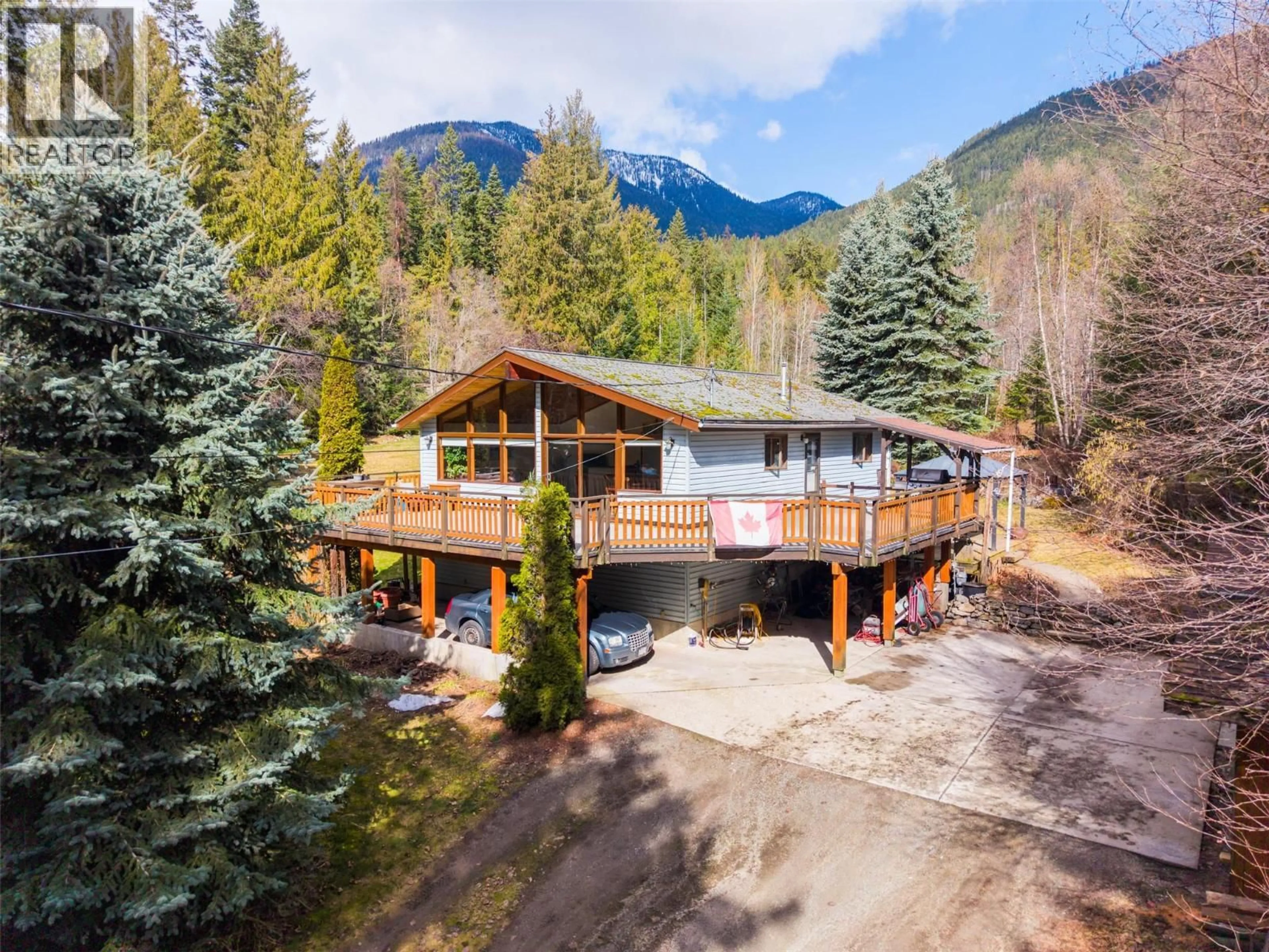 A pic from outside/outdoor area/front of a property/back of a property/a pic from drone, mountain view for 7077 BEGGS ROAD, Nelson British Columbia V1L6S5