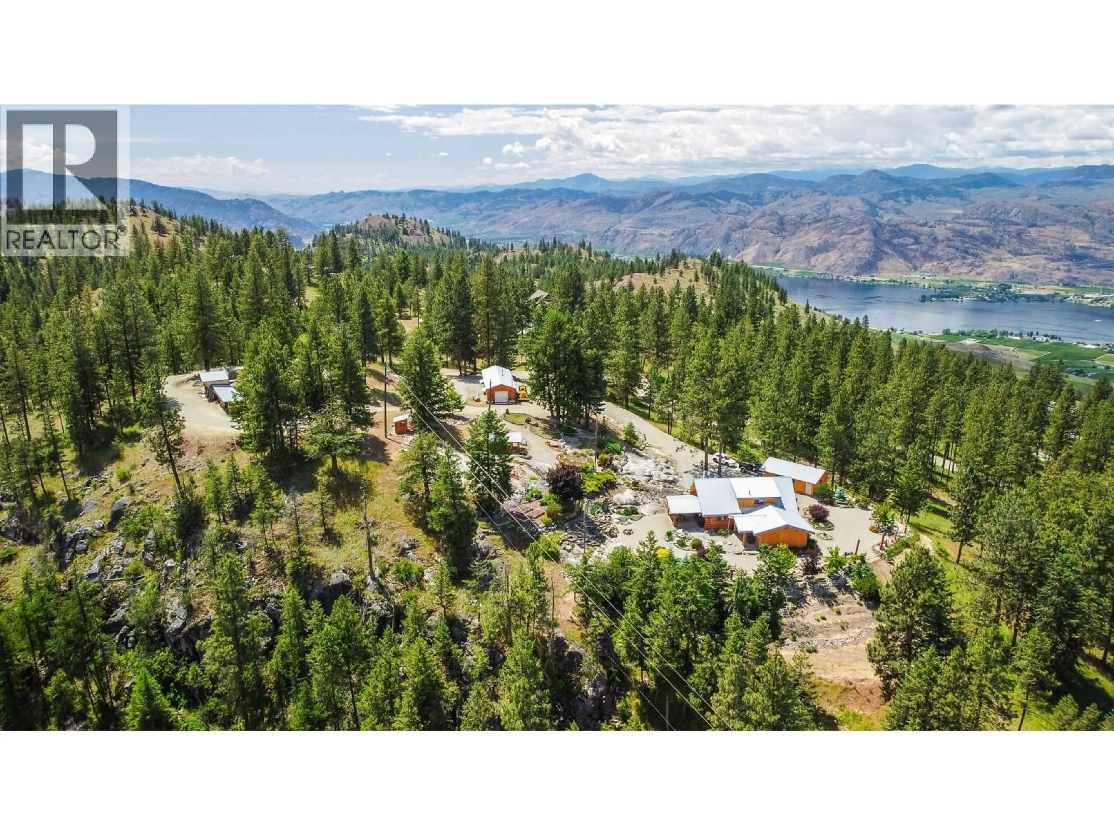 A pic from outside/outdoor area/front of a property/back of a property/a pic from drone, mountain view for 118 MAGUIRE ROAD, Osoyoos British Columbia V0H1V6