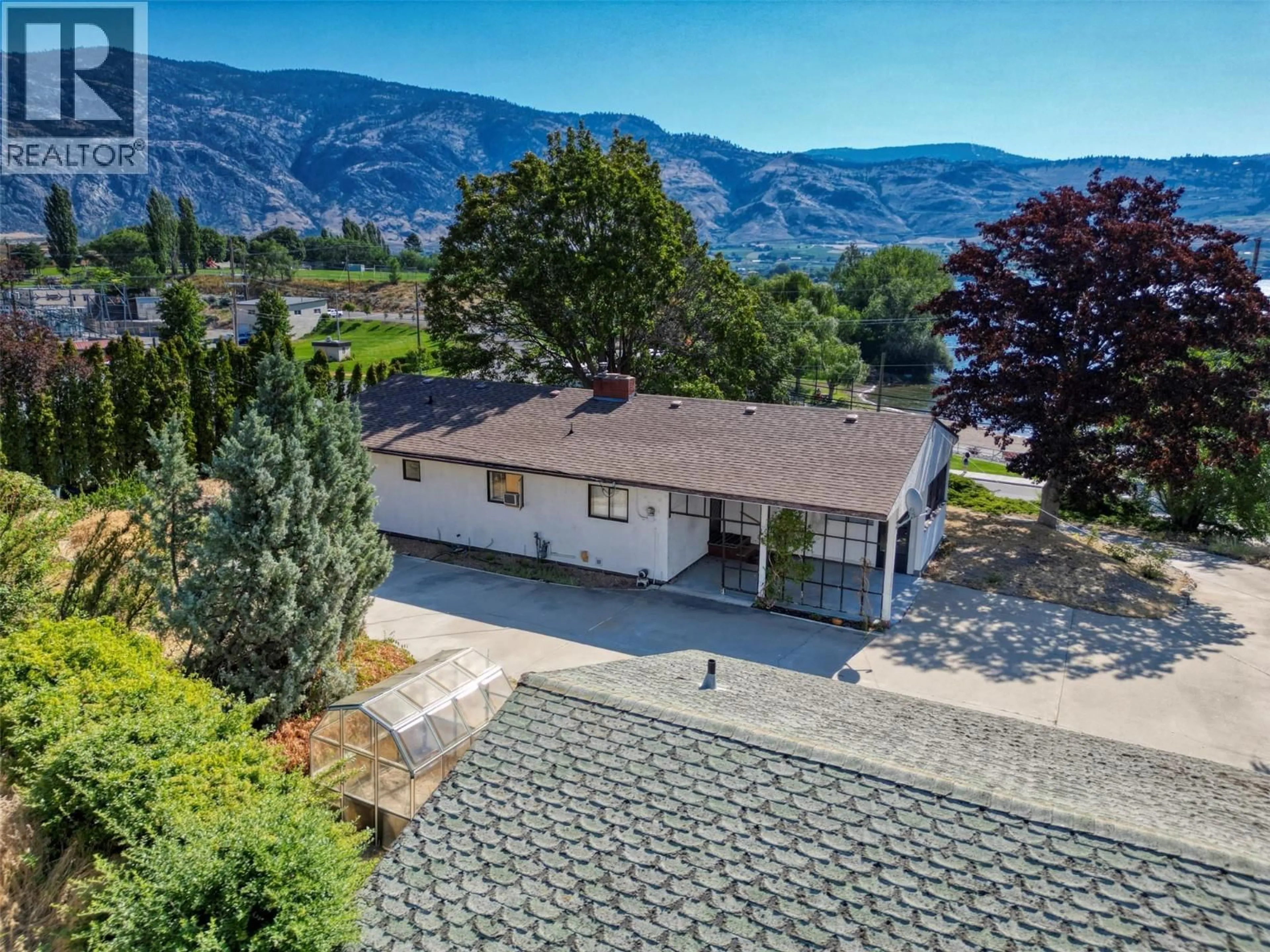 A pic from outside/outdoor area/front of a property/back of a property/a pic from drone, mountain view for 6406 89TH STREET, Osoyoos British Columbia V0H1V1