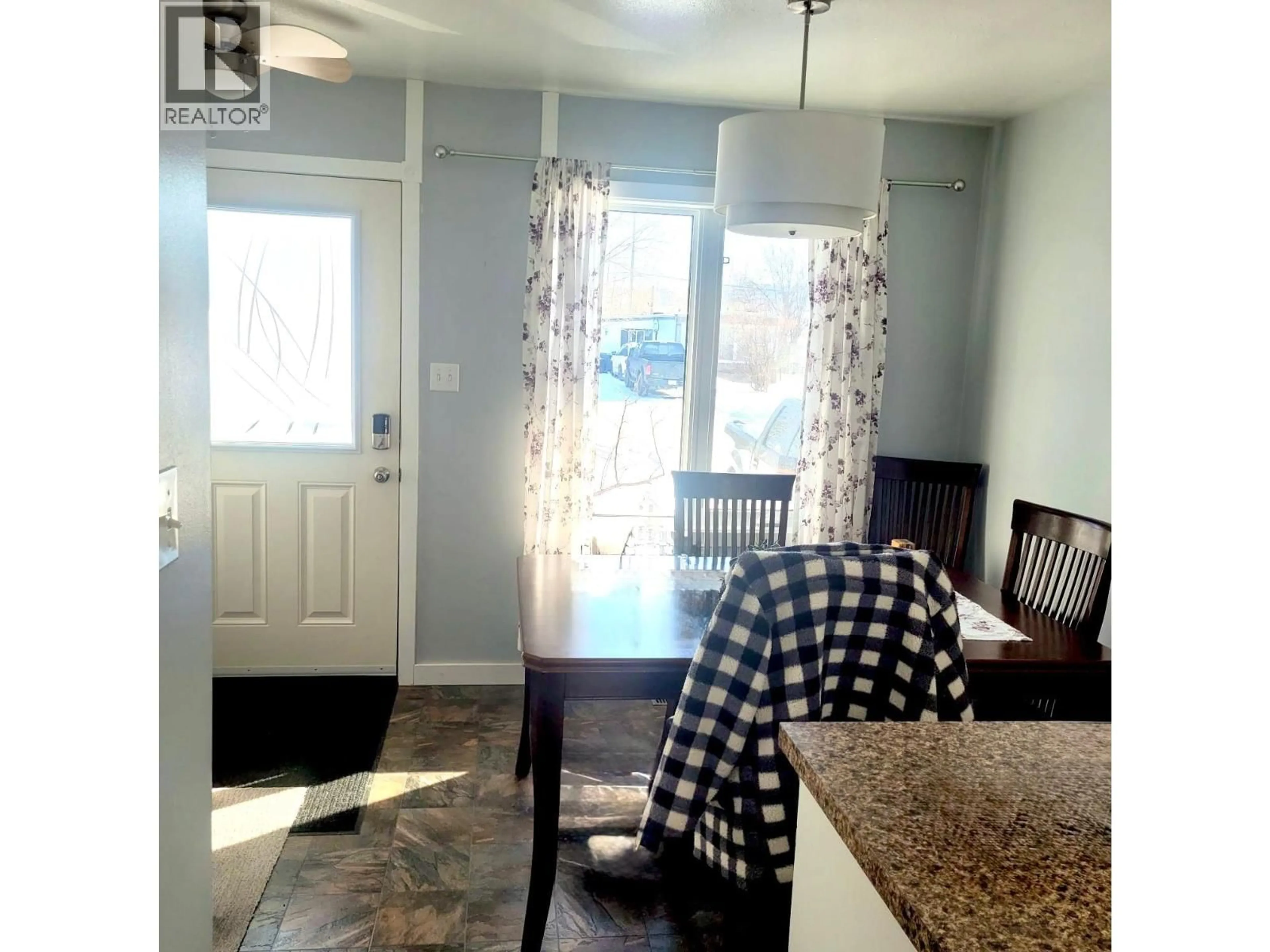 Dining room, wood/laminate floor for 1036 121 AVENUE, Dawson Creek British Columbia V1G3K4