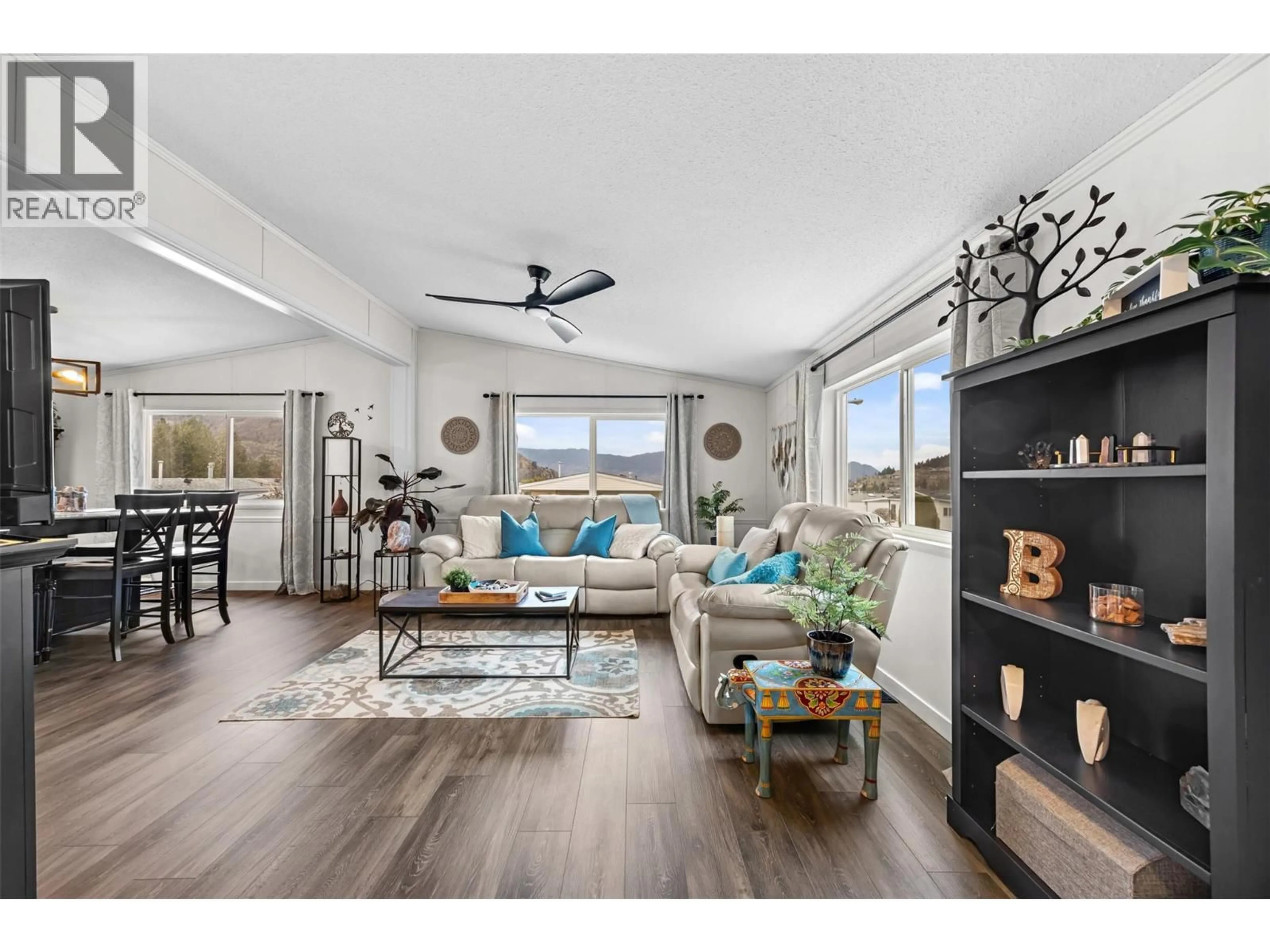 Living room with furniture, wood/laminate floor for 93 - 1850 SHANNON LAKE ROAD, West Kelowna British Columbia V4T1L6