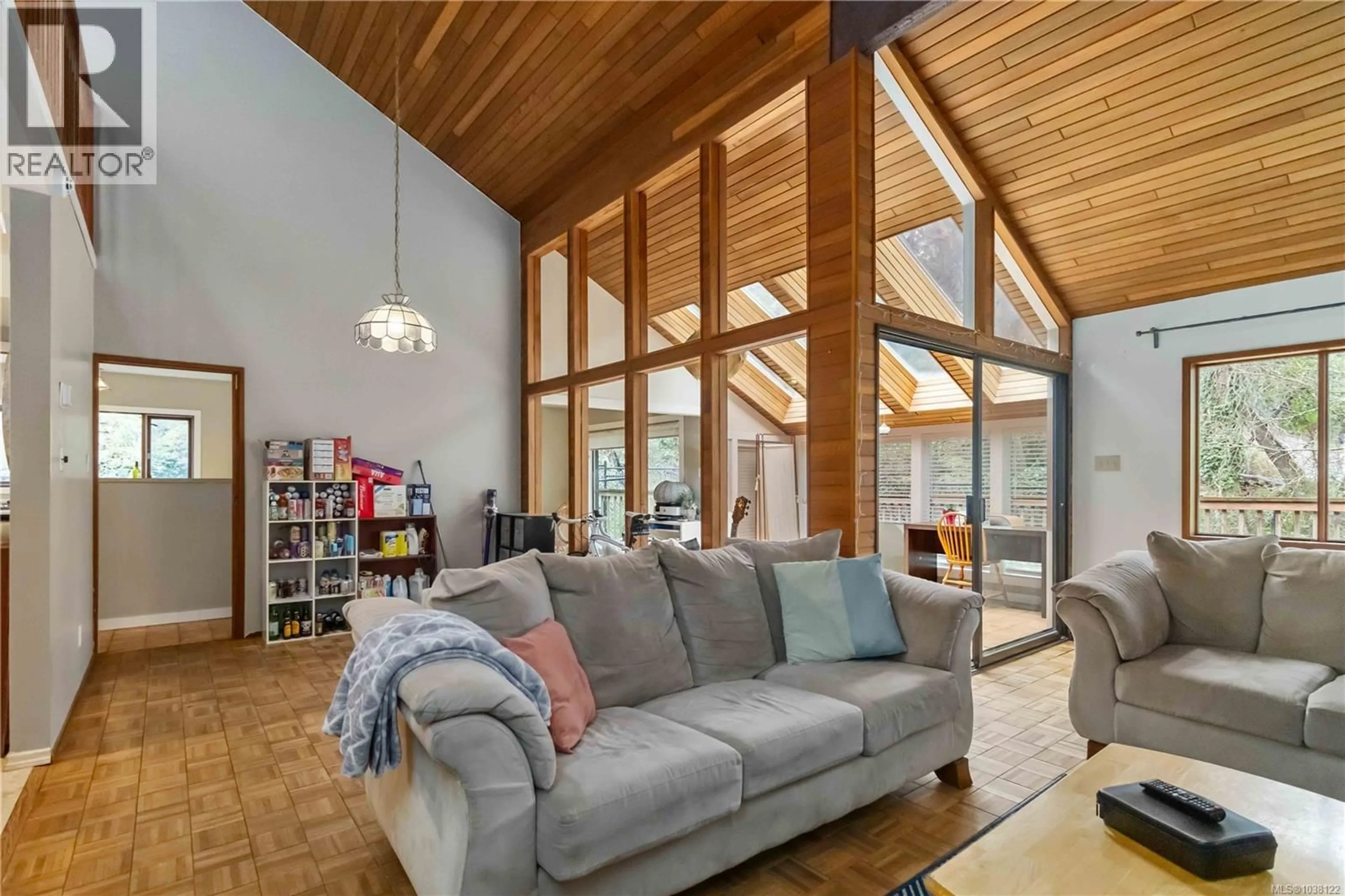 Living room with furniture, wood/laminate floor for 2753 ARBUTUS ROAD, Saanich British Columbia V8N5X7