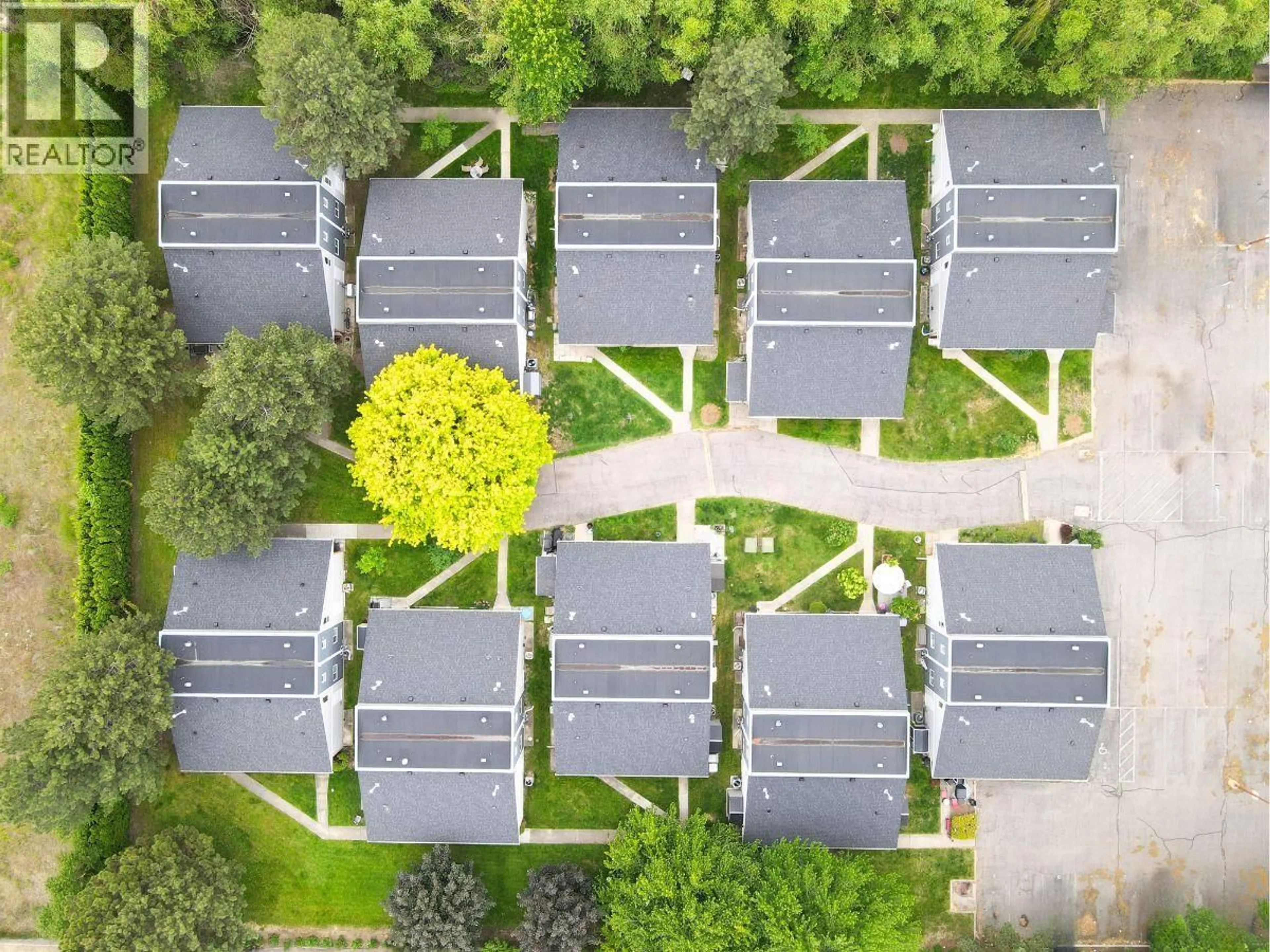 A pic from outside/outdoor area/front of a property/back of a property/a pic from drone, street for 202 - 3155 GORDON DRIVE, Kelowna British Columbia V1W3N5
