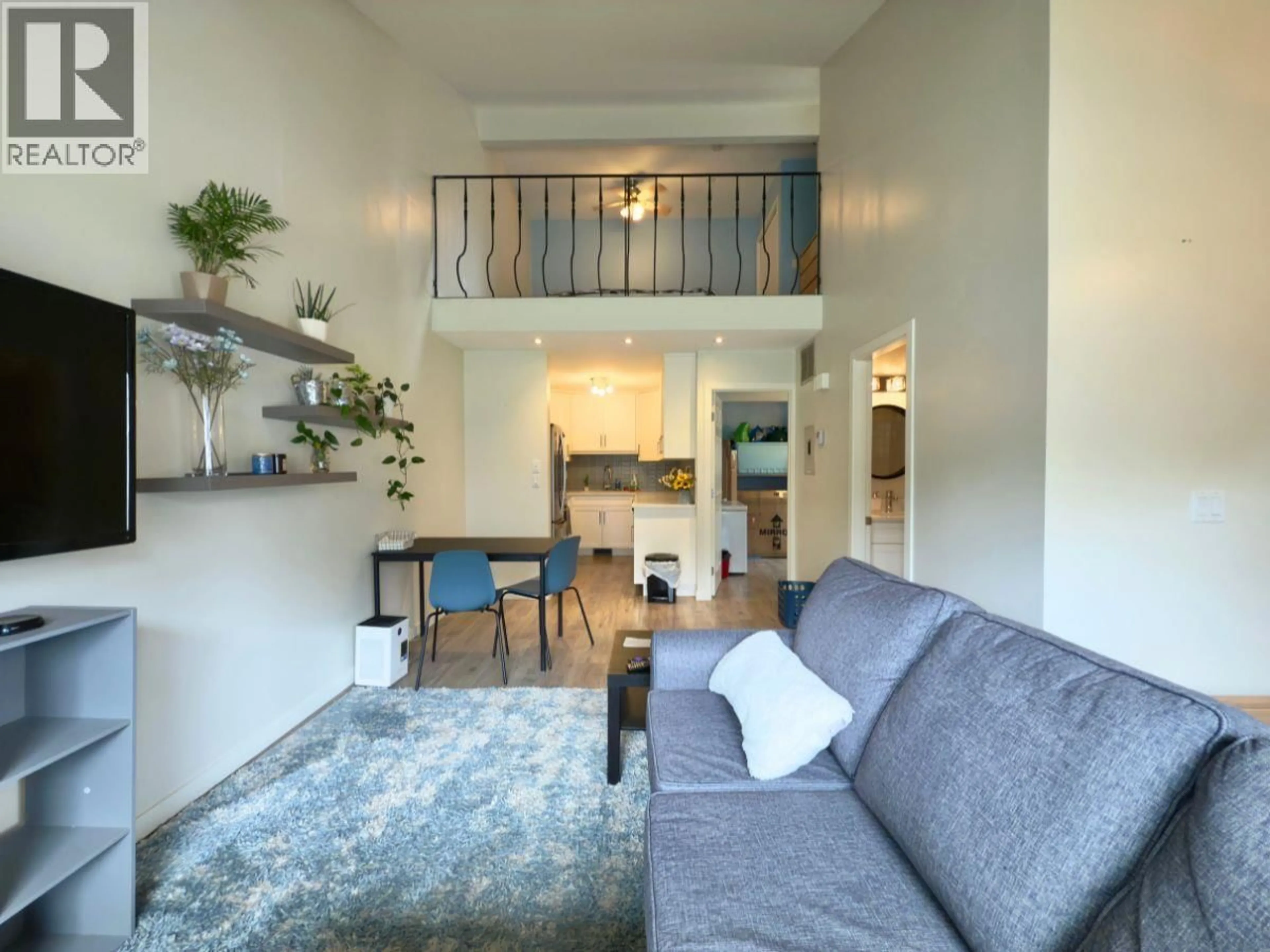 Living room with furniture, unknown for 202 - 3155 GORDON DRIVE, Kelowna British Columbia V1W3N5