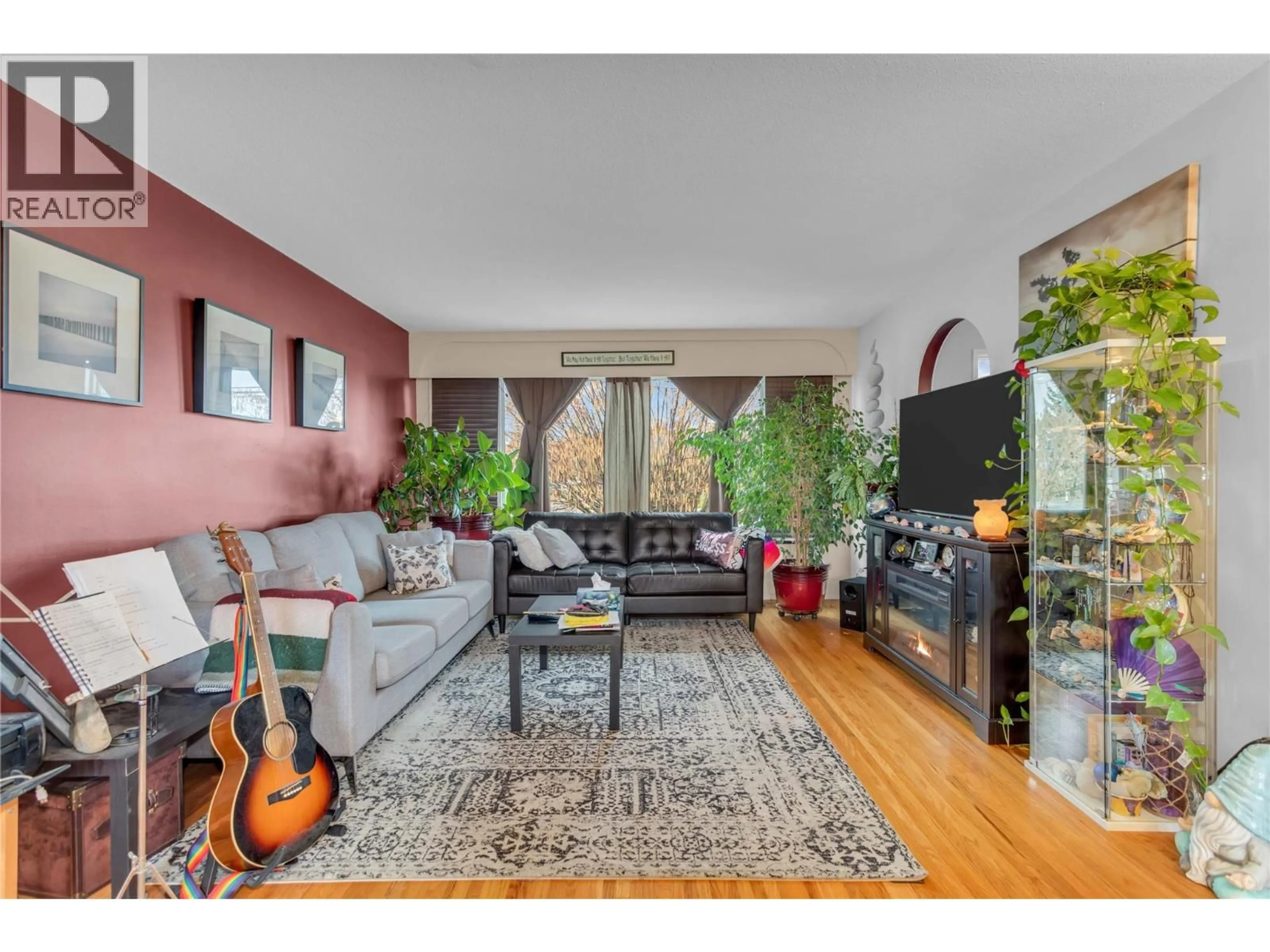 Living room with furniture, wood/laminate floor for 1270 HOUGHTON ROAD, Kelowna British Columbia V1X2C9