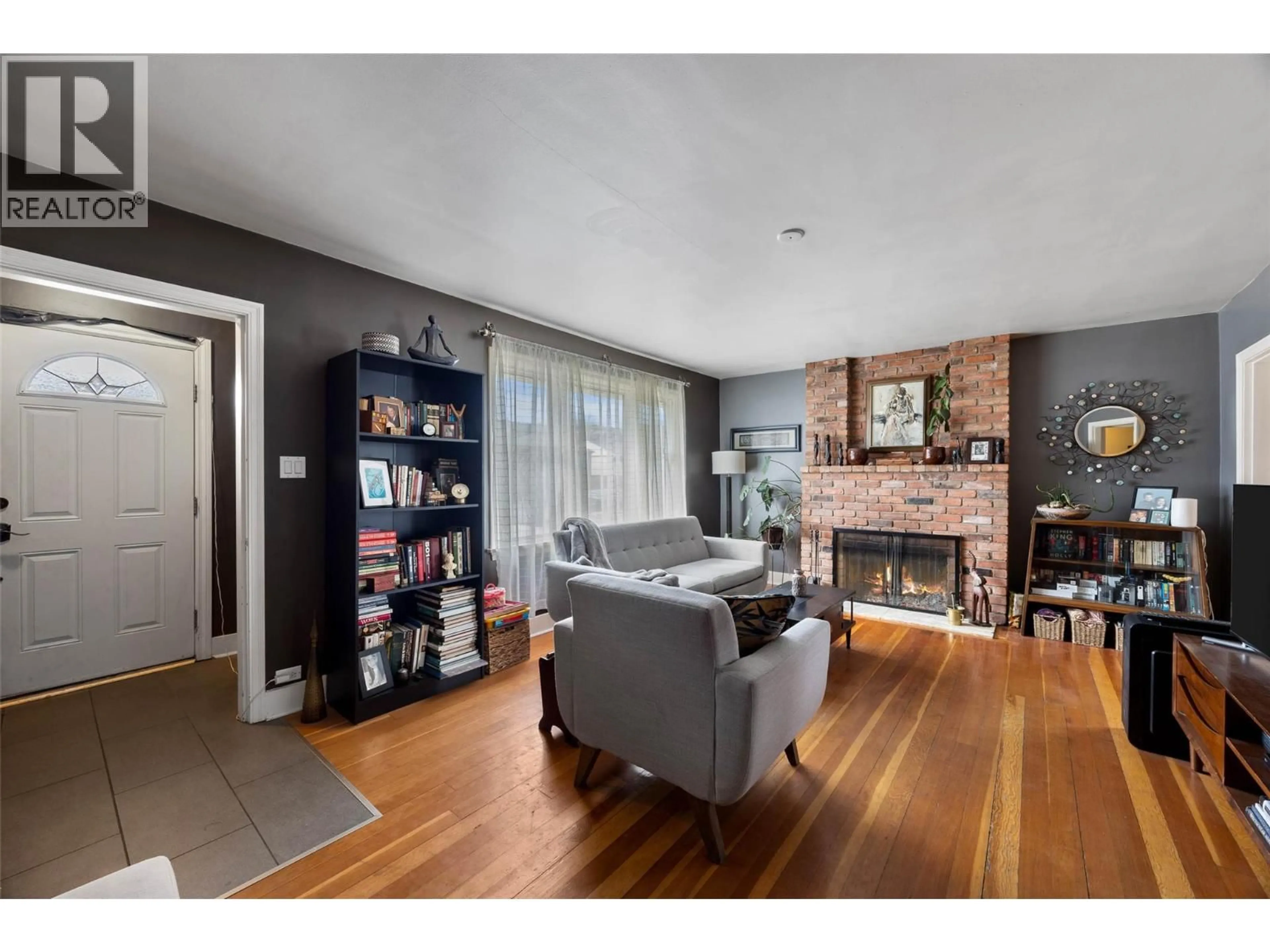 Living room with furniture, wood/laminate floor for 1086 COLUMBIA STREET, Kamloops British Columbia V2C2W2