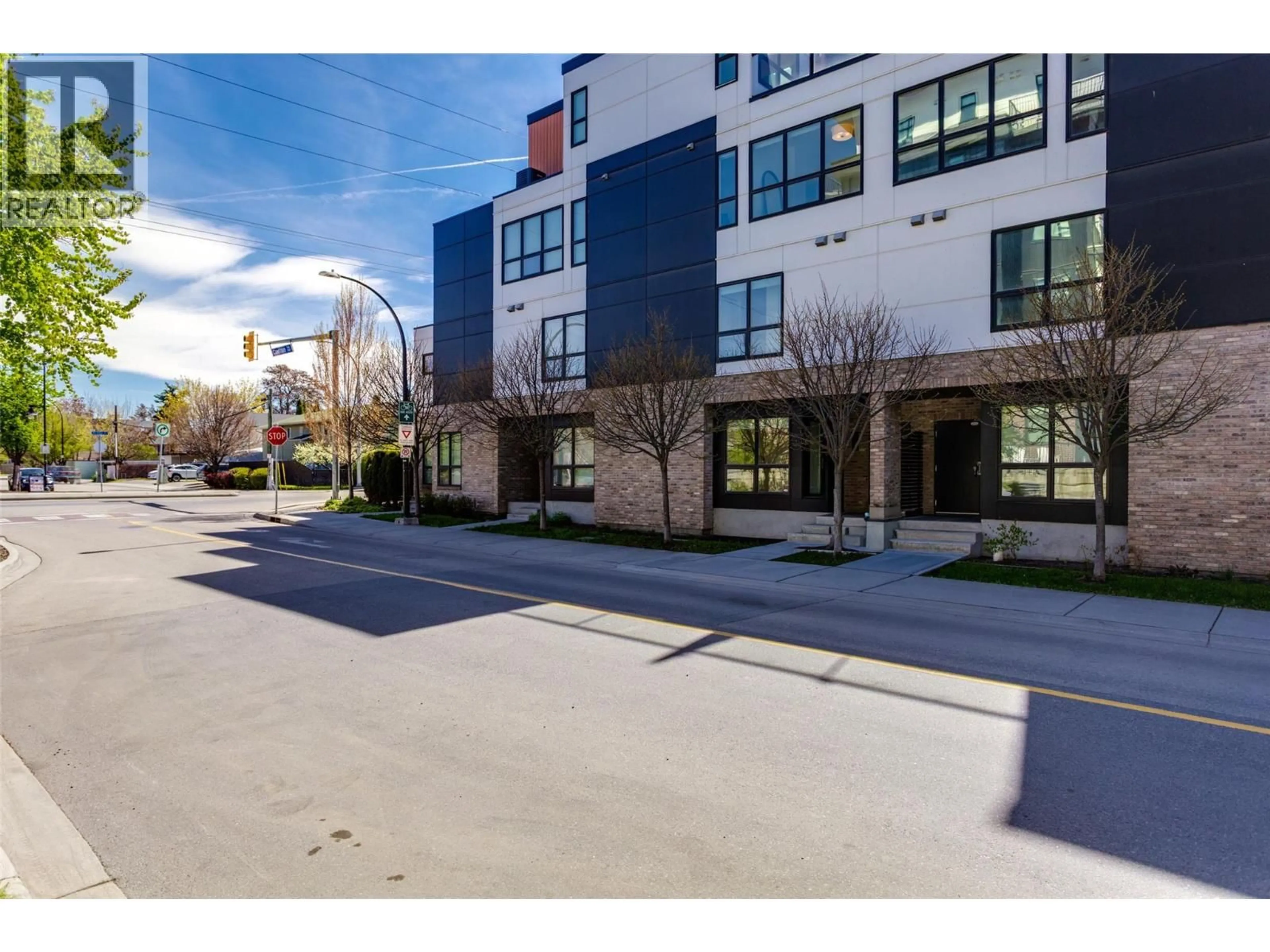 A pic from outside/outdoor area/front of a property/back of a property/a pic from drone, street for 104 - 1308 RICHTER STREET, Kelowna British Columbia V1Y2L3