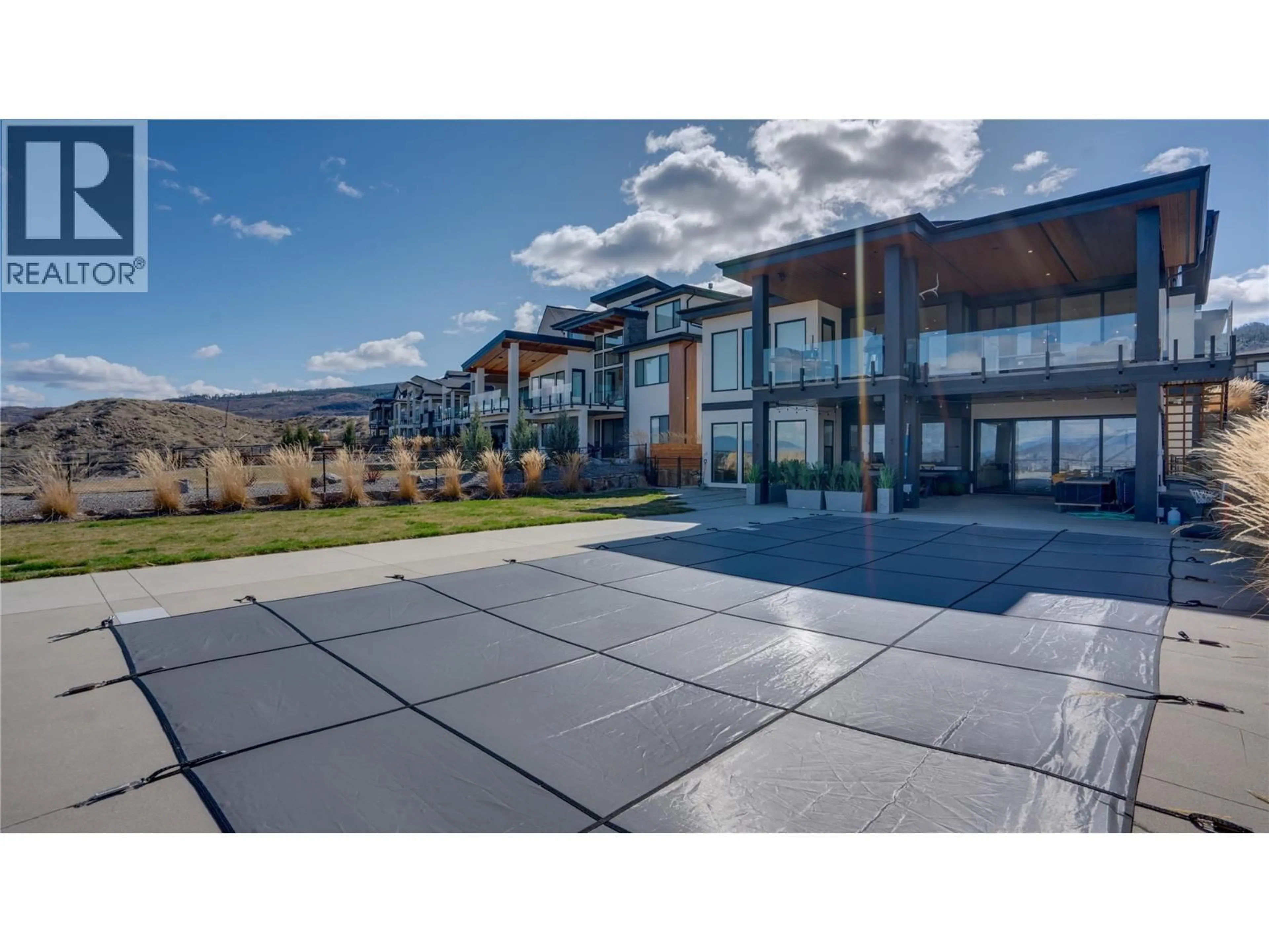 A pic from outside/outdoor area/front of a property/back of a property/a pic from drone, mountain view for 1220 PONDS AVENUE, Kelowna British Columbia V1W5N1