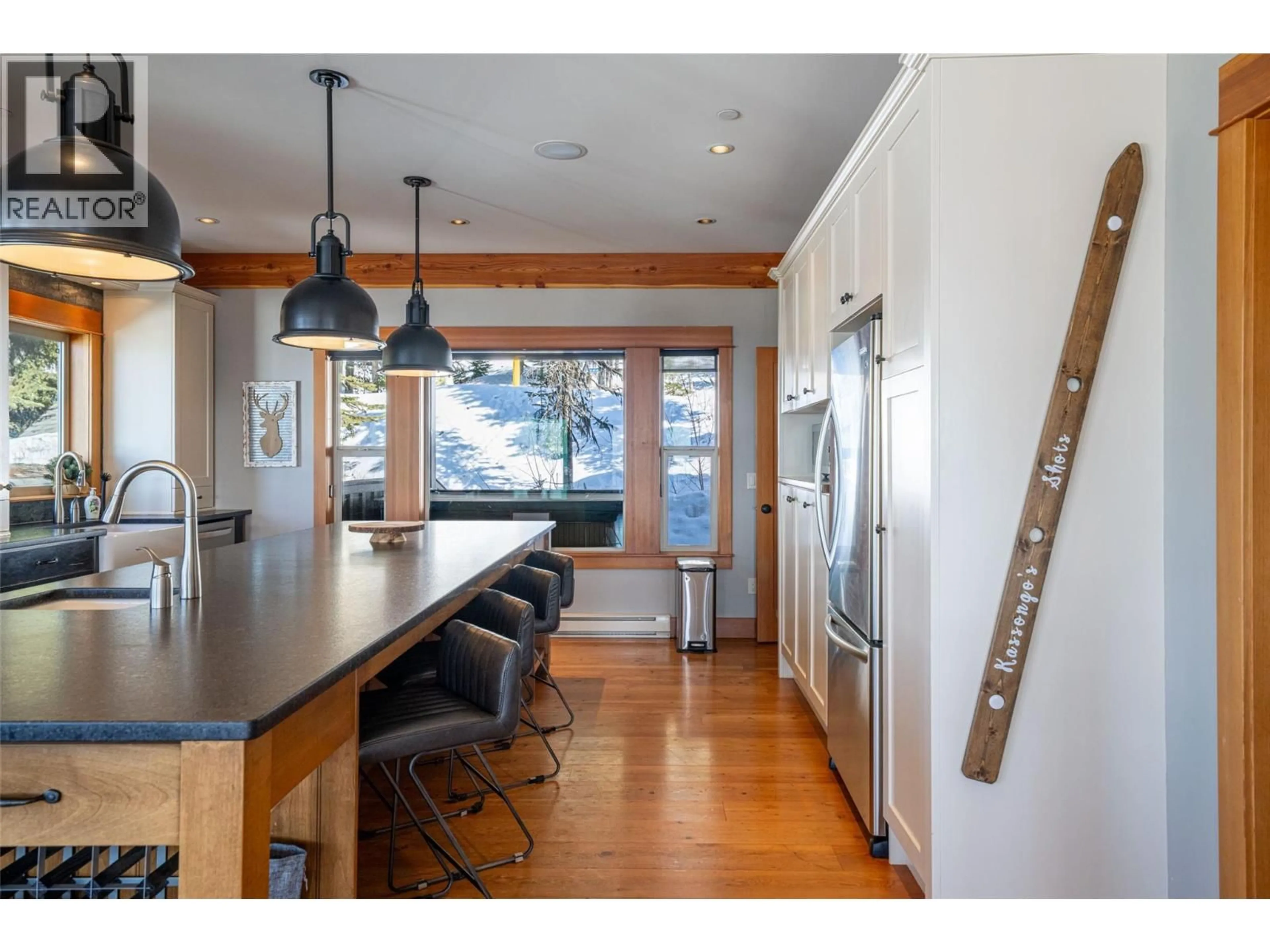 Open concept kitchen, wood/laminate floor for 9826 CATHEDRAL DRIVE, Silver Star British Columbia V1B3M1
