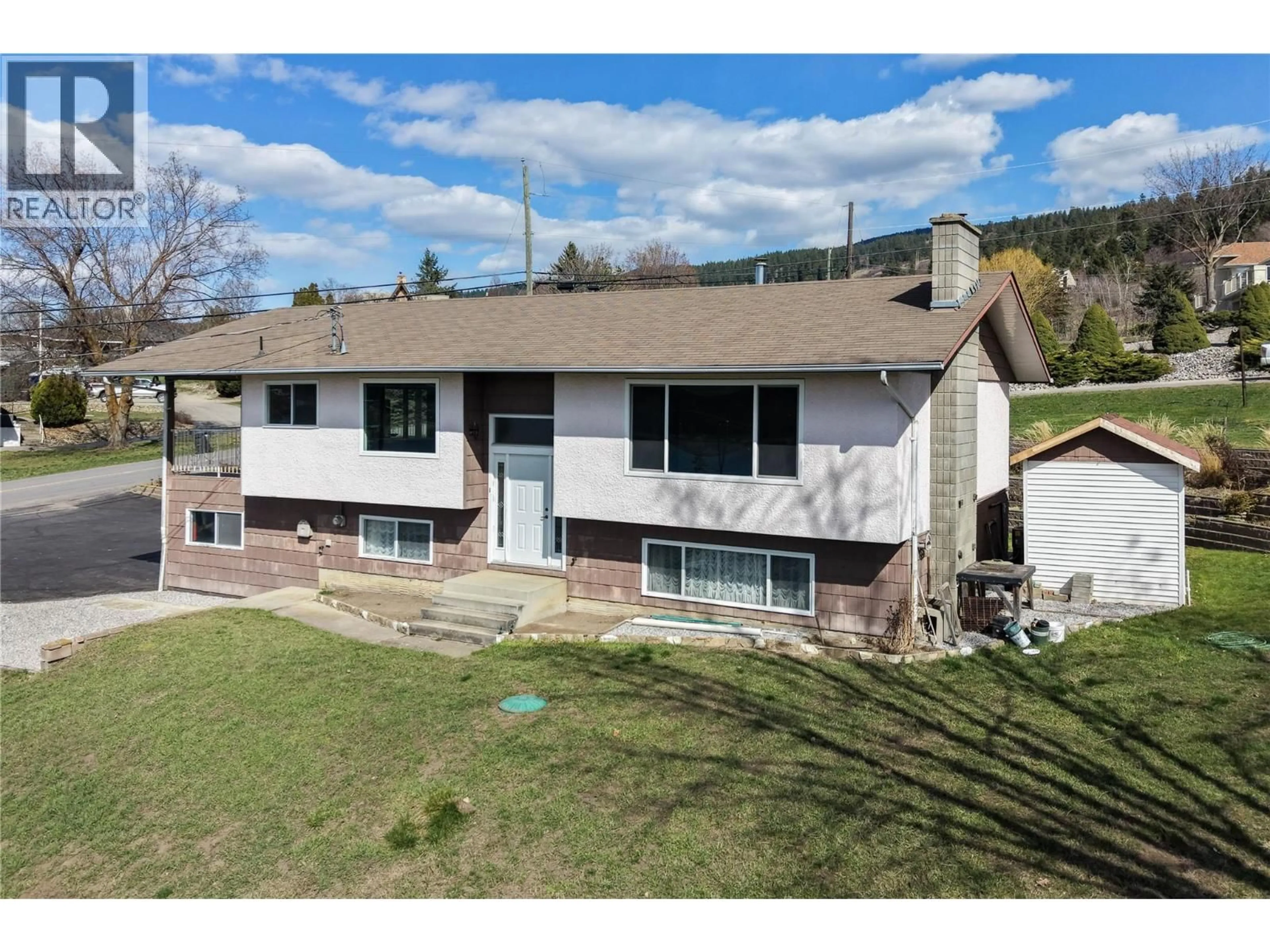 A pic from outside/outdoor area/front of a property/back of a property/a pic from drone, mountain view for 7515 L & A ROAD, Vernon British Columbia V1B3S5