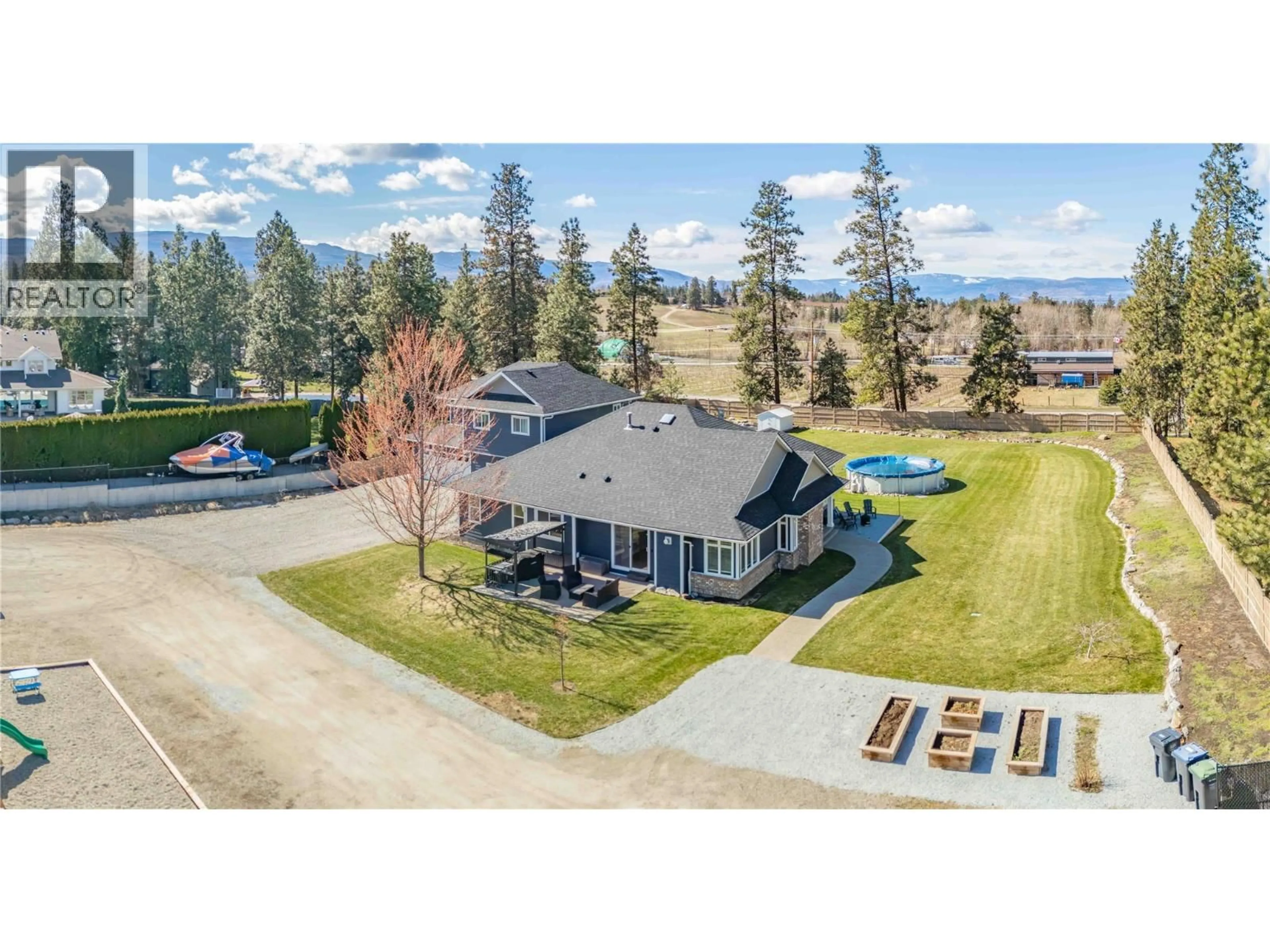 A pic from outside/outdoor area/front of a property/back of a property/a pic from drone, water/lake/river/ocean view for 3350 LARKSPUR COURT, Kelowna British Columbia V1W4E4