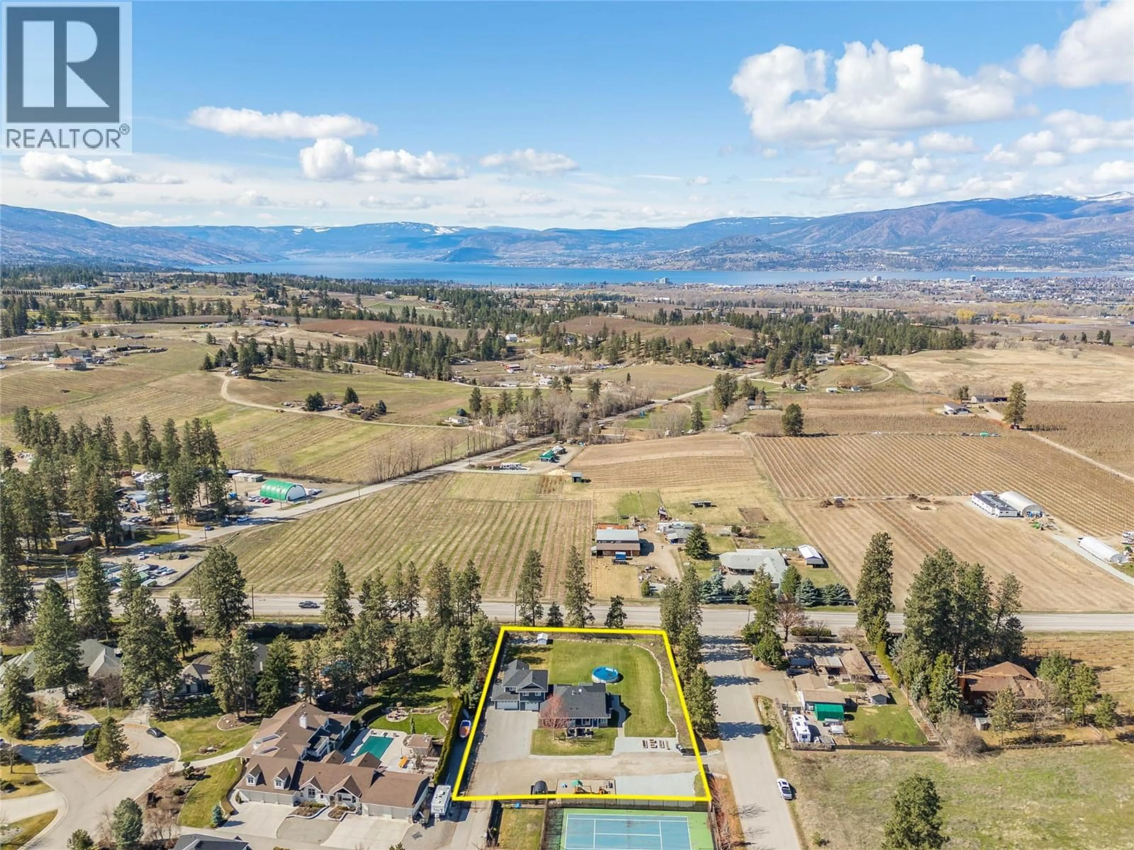 A pic from outside/outdoor area/front of a property/back of a property/a pic from drone, mountain view for 3350 LARKSPUR COURT, Kelowna British Columbia V1W4E4