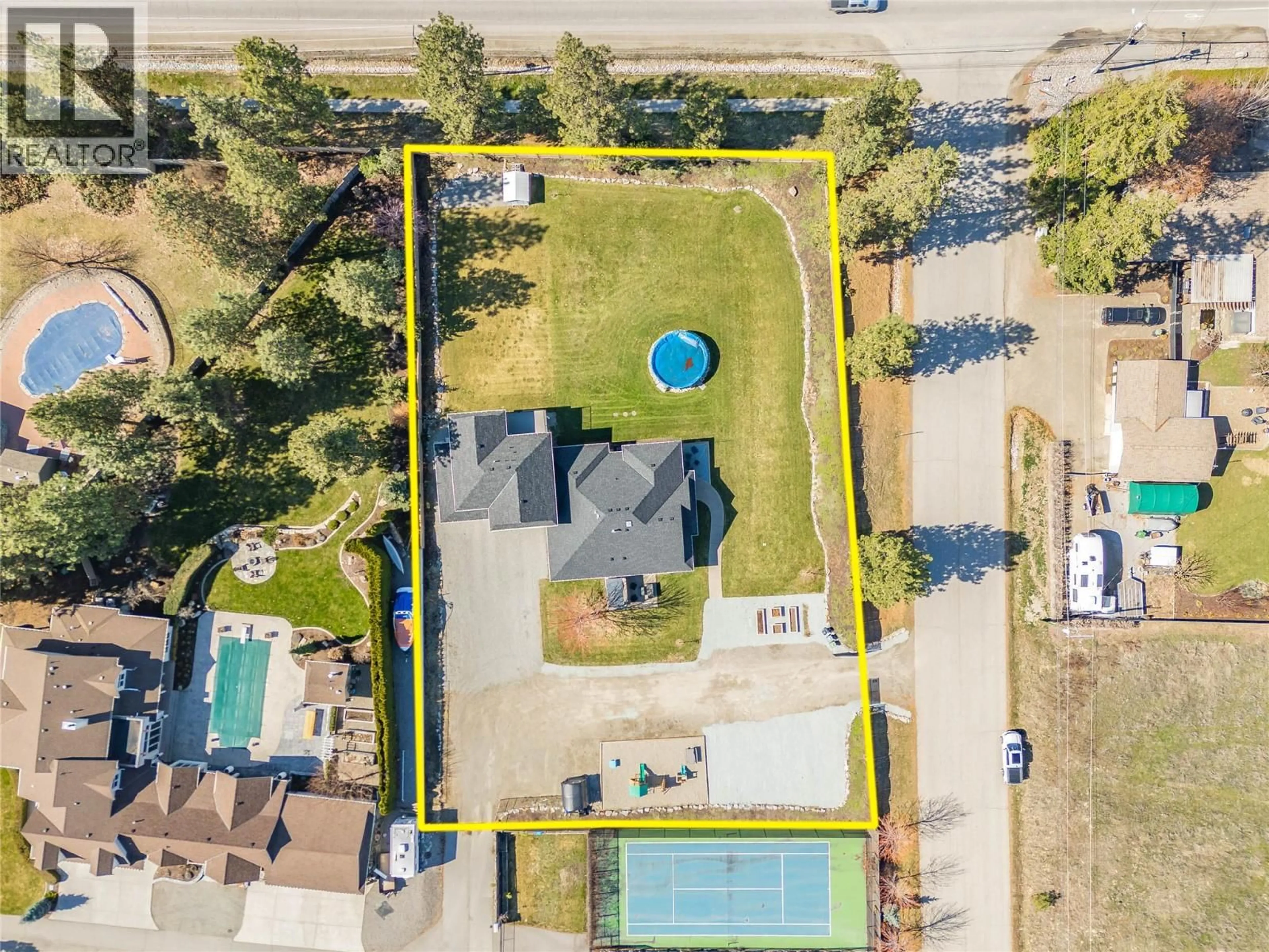 A pic from outside/outdoor area/front of a property/back of a property/a pic from drone, street for 3350 LARKSPUR COURT, Kelowna British Columbia V1W4E4