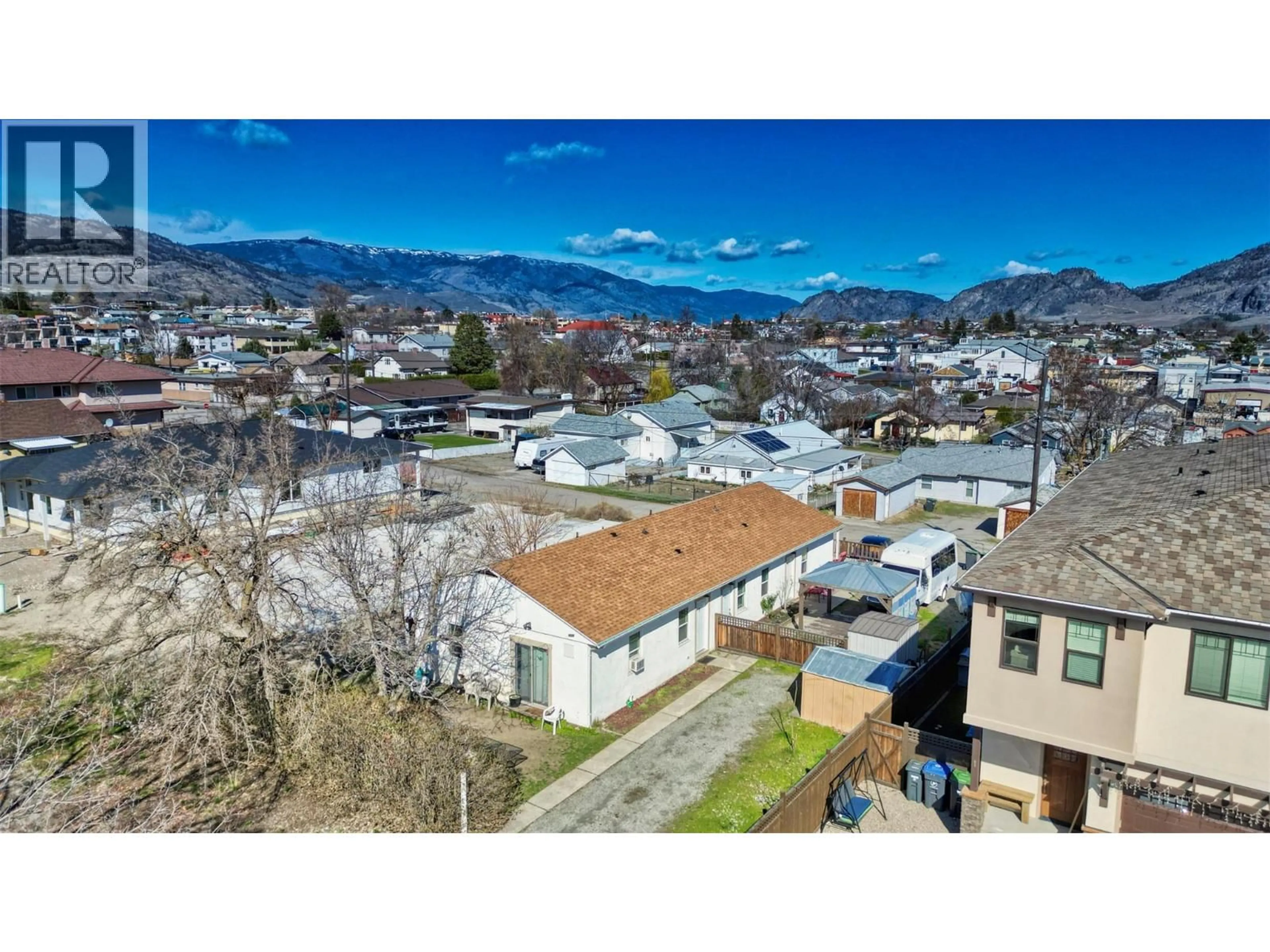 A pic from outside/outdoor area/front of a property/back of a property/a pic from drone, mountain view for 8506 70TH AVENUE, Osoyoos British Columbia V0H1V0