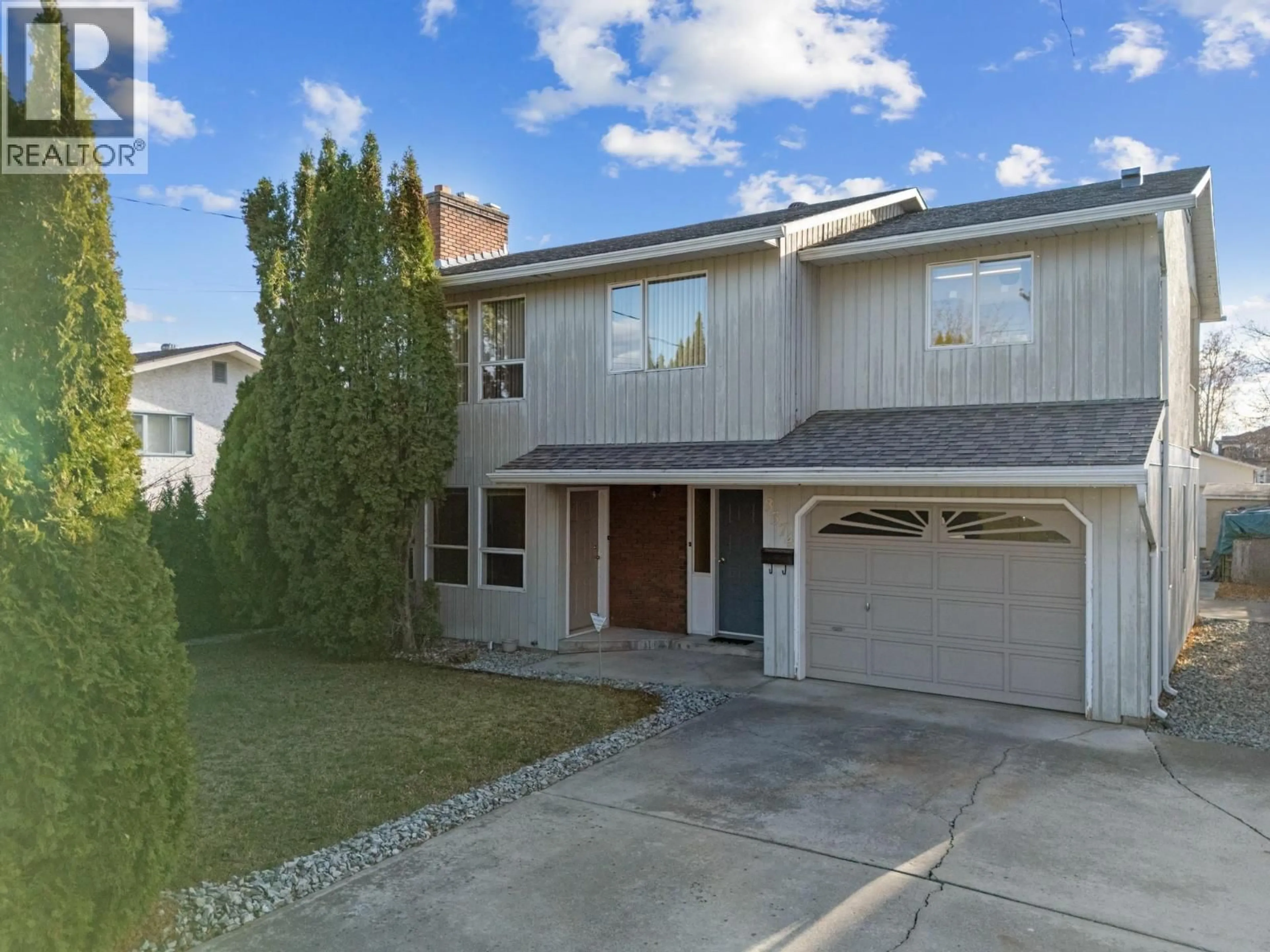 Home with vinyl exterior material, street for 3574 LANDIE ROAD, Kelowna British Columbia V1W3E9