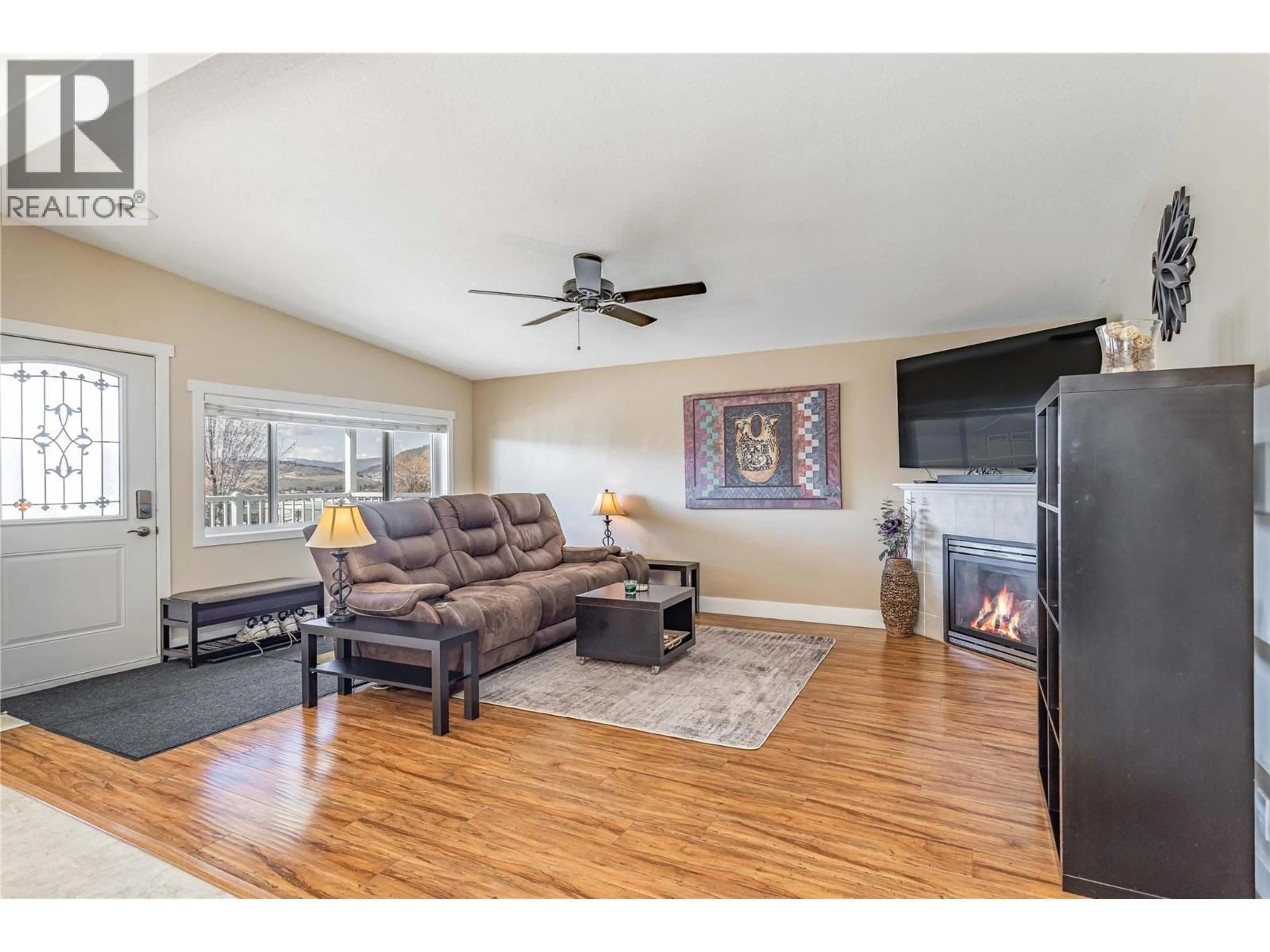 Living room with furniture, wood/laminate floor for 1303 - 2440 OLD OKANAGAN HIGHWAY, Westbank British Columbia V4T3A2