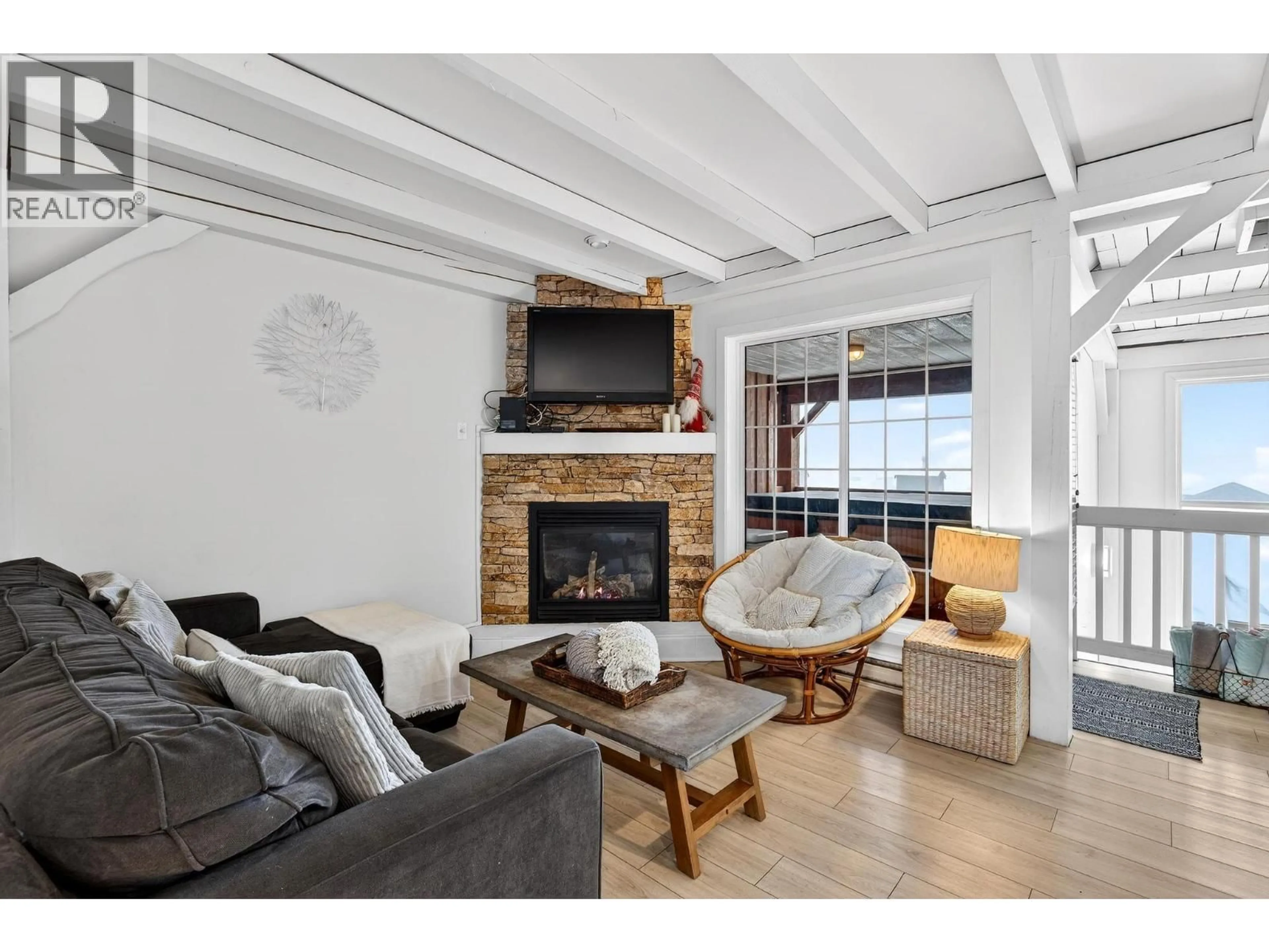 Living room with furniture, wood/laminate floor for 13 - 220 KETTLEVIEW ROAD, Big White British Columbia V1P1P3