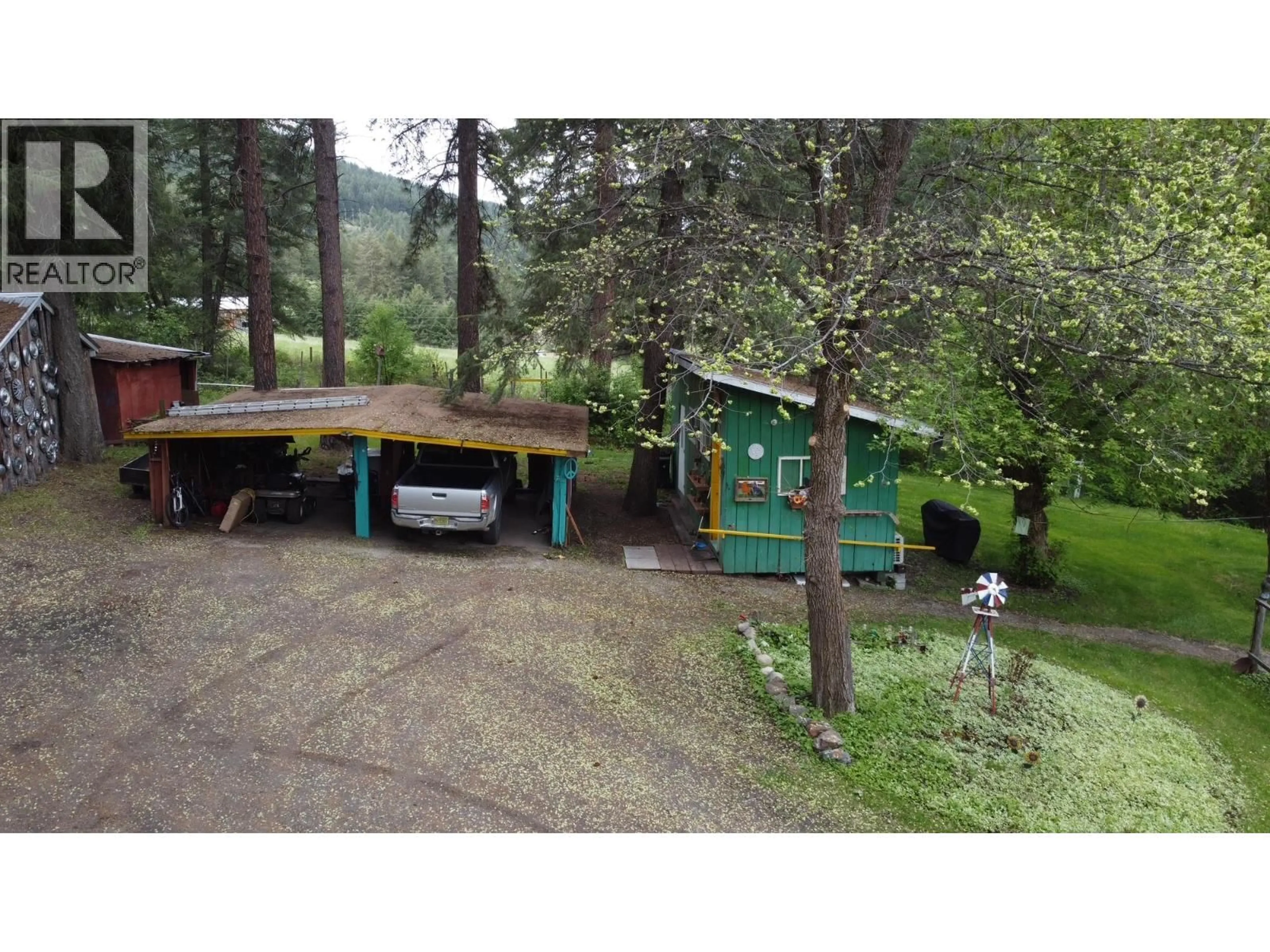 A pic from outside/outdoor area/front of a property/back of a property/a pic from drone, forest/trees view for 3900 HIGHWAY 3 OTHER, Rock Creek British Columbia V0H1Y0