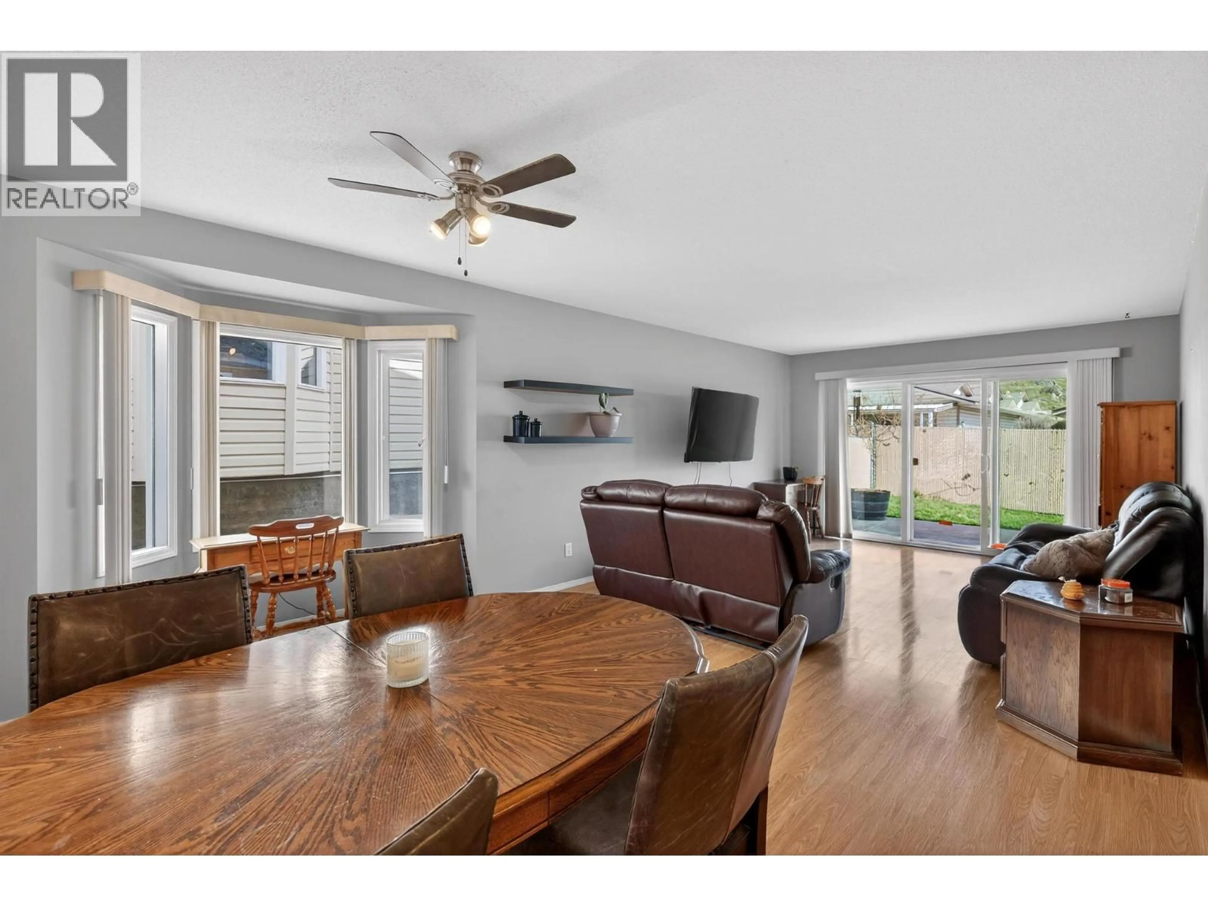 Living room with furniture, wood/laminate floor for 5 - 4600 BELLA VISTA ROAD, Vernon British Columbia V1T2N4