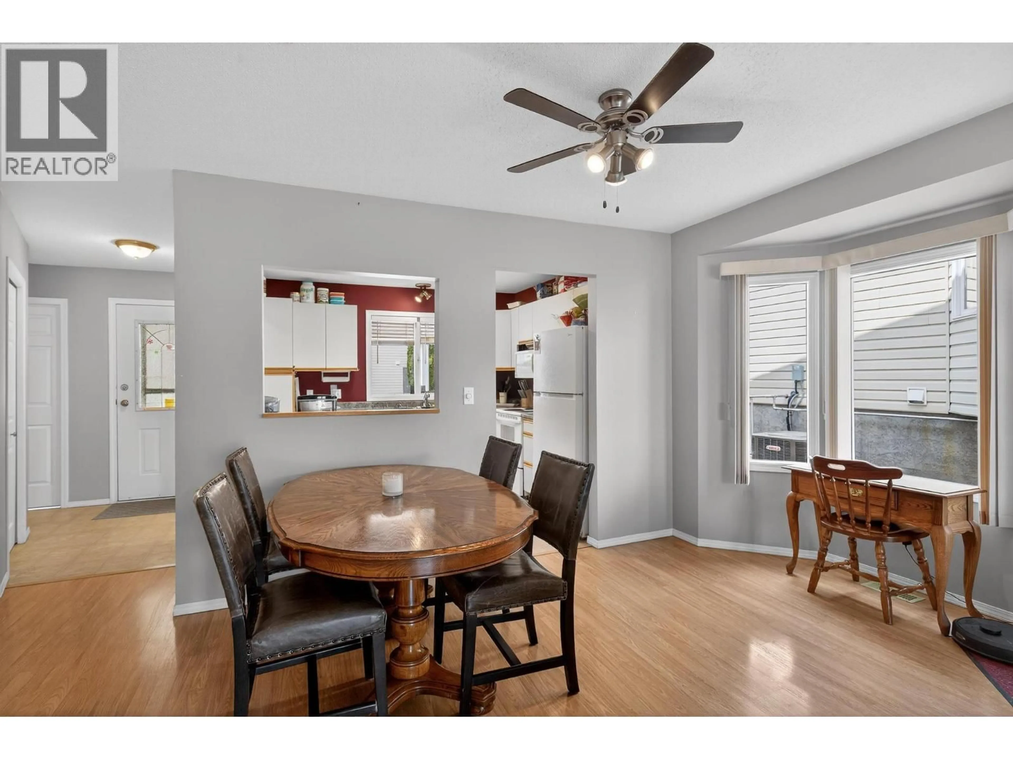 Dining room, wood/laminate floor for 5 - 4600 BELLA VISTA ROAD, Vernon British Columbia V1T2N4