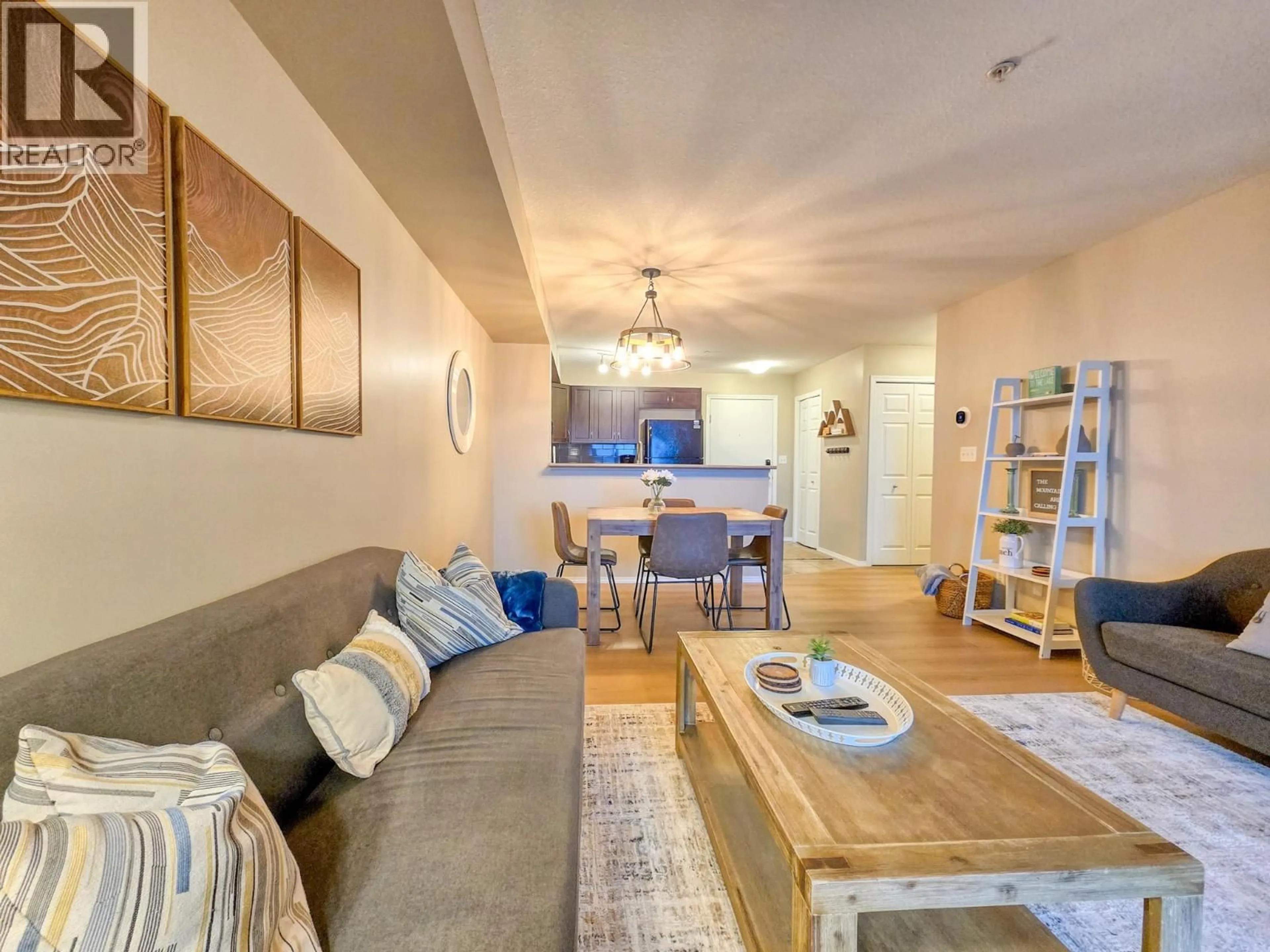 Living room with furniture, wood/laminate floor for 2305 - 205 THIRD AVENUE, Invermere British Columbia V0A1K0