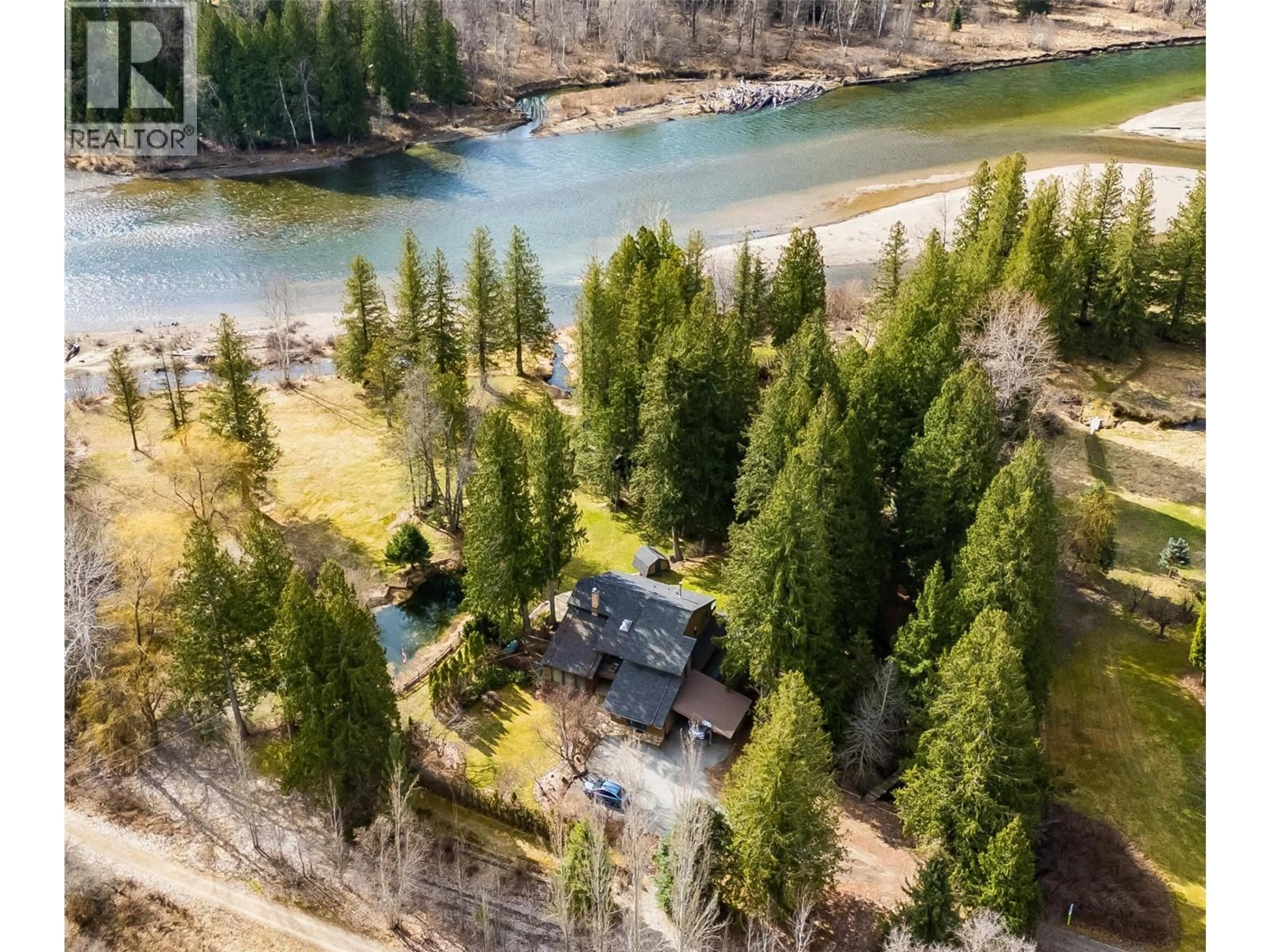 A pic from outside/outdoor area/front of a property/back of a property/a pic from drone, water/lake/river/ocean view for 2827 EVIN ROAD, Slocan Park British Columbia V0G2E0