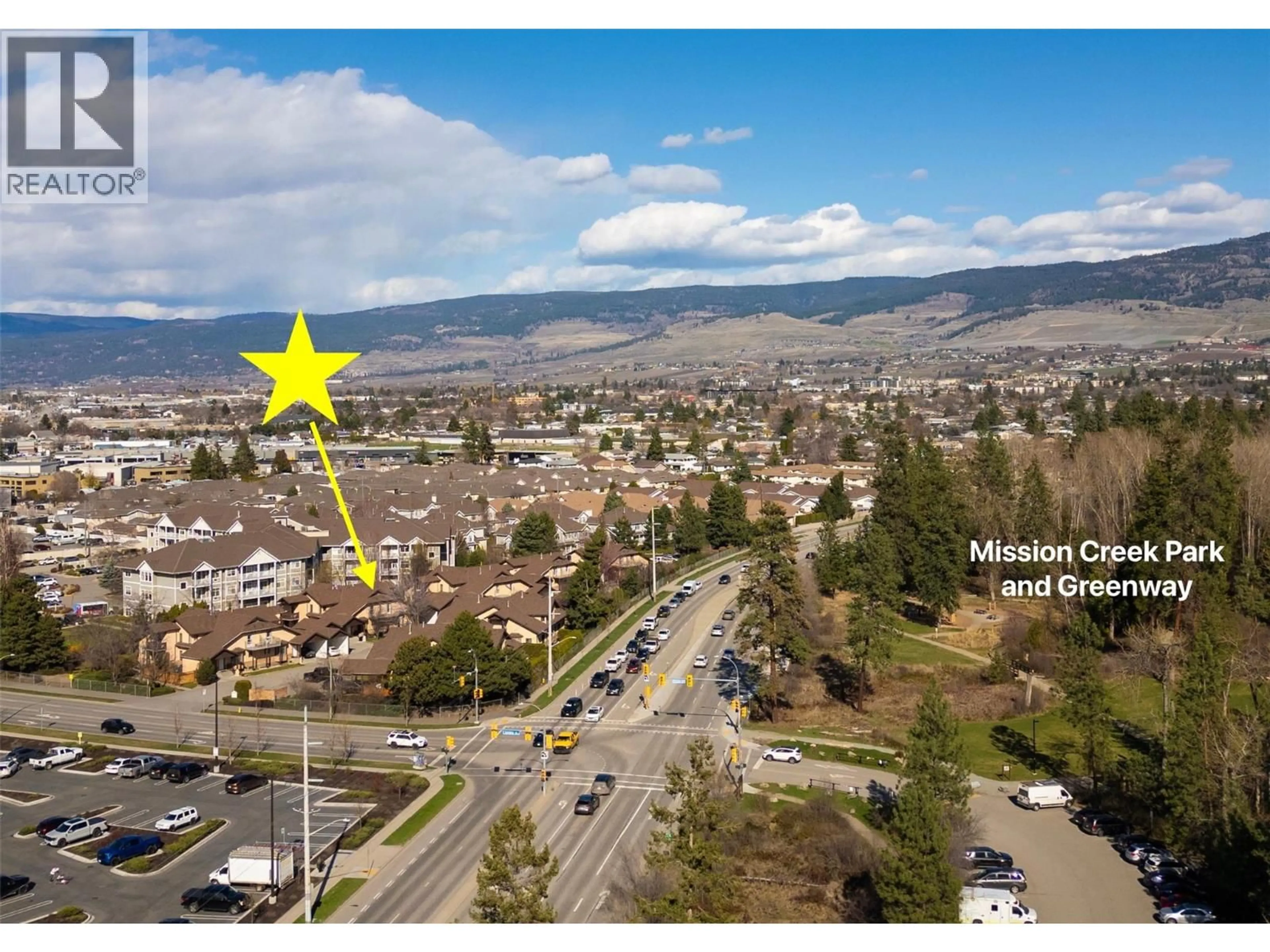 A pic from outside/outdoor area/front of a property/back of a property/a pic from drone, mountain view for #105 - 1855 LECKIE ROAD, Kelowna British Columbia V1Y8B7