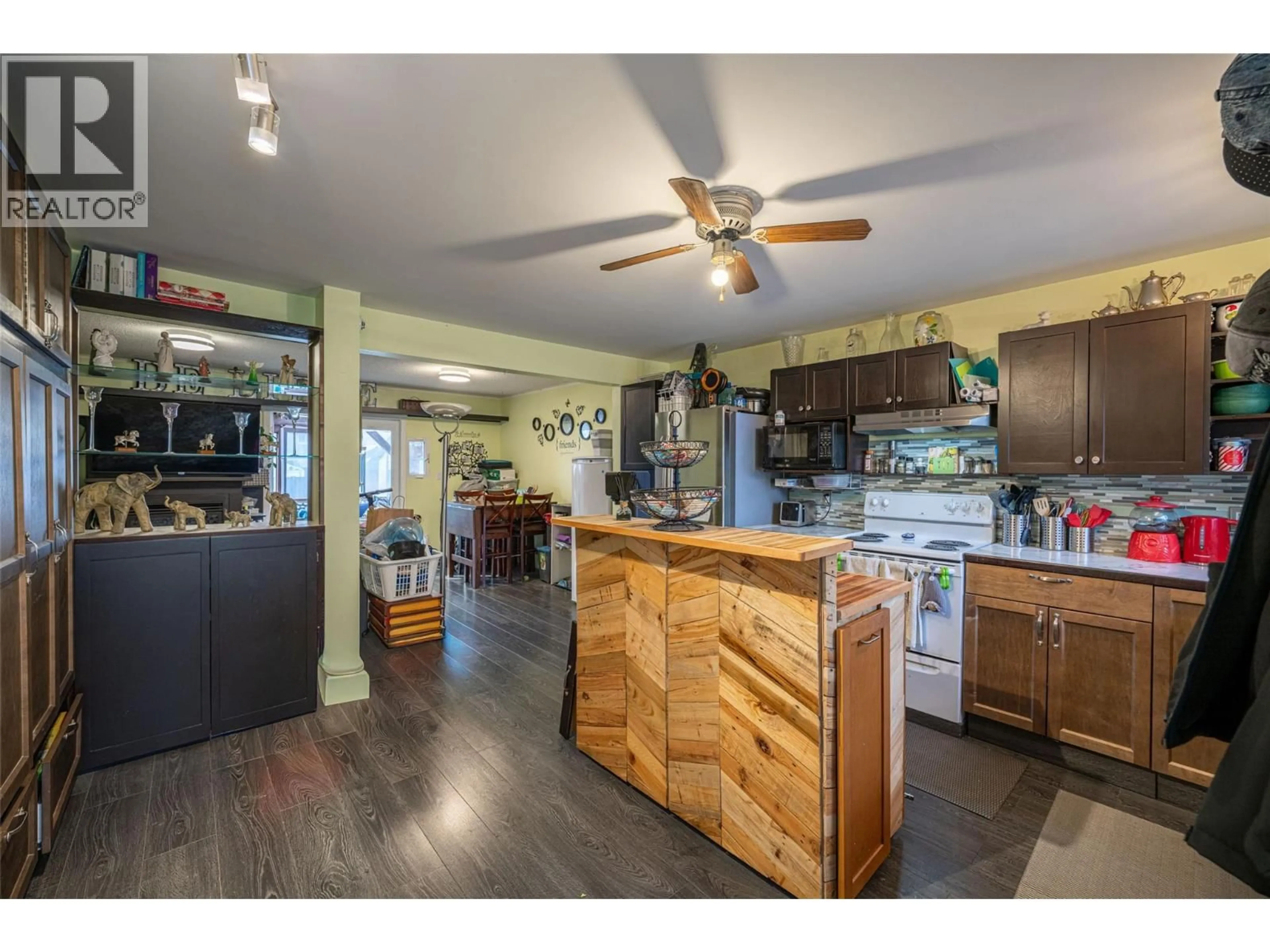Open concept kitchen, wood/laminate floor for 1816 43 STREET, Vernon British Columbia V1T6W8