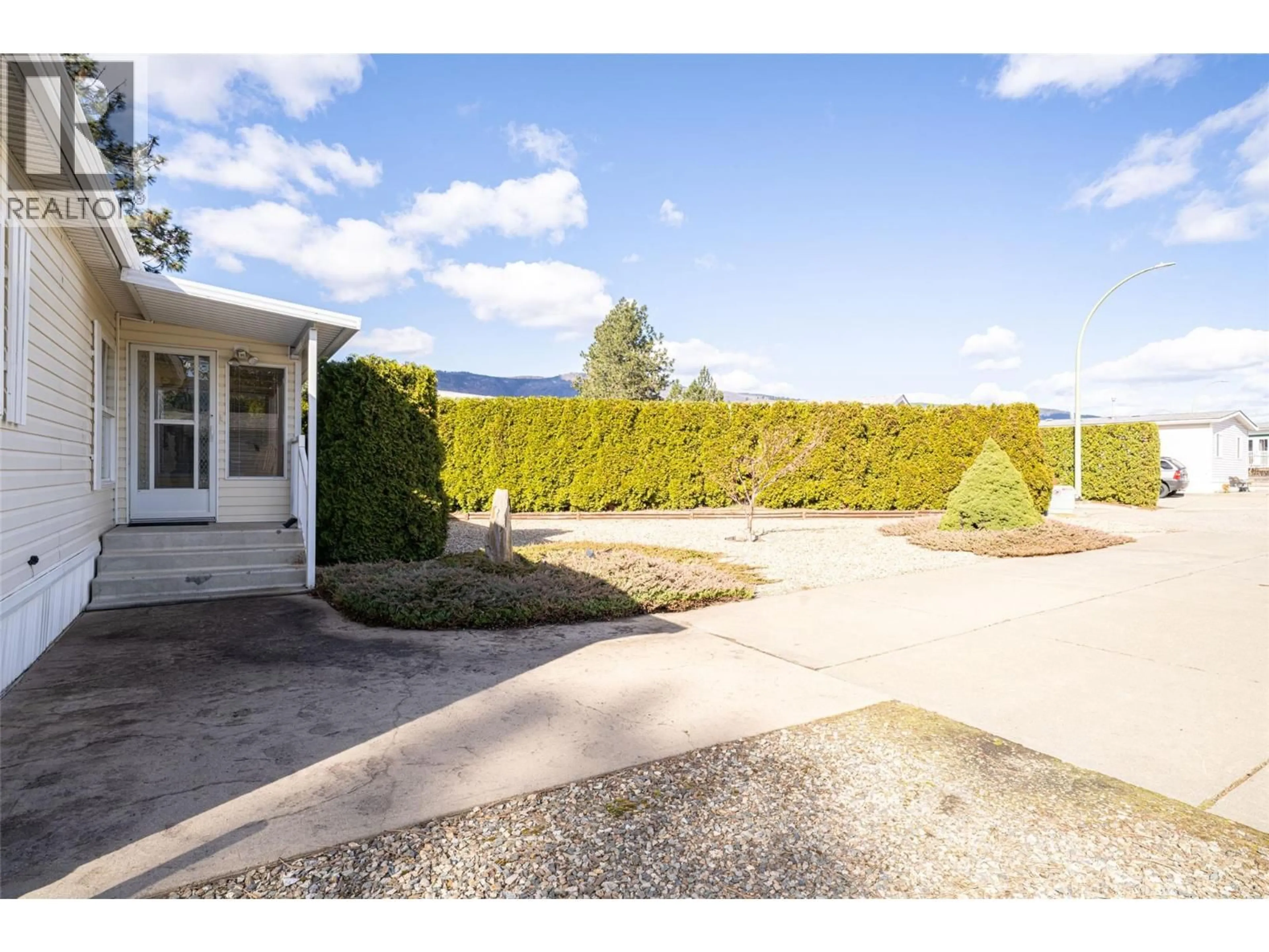 A pic from outside/outdoor area/front of a property/back of a property/a pic from drone, mountain view for 5 - 9510 97N HIGHWAY, Vernon British Columbia V1H1R8