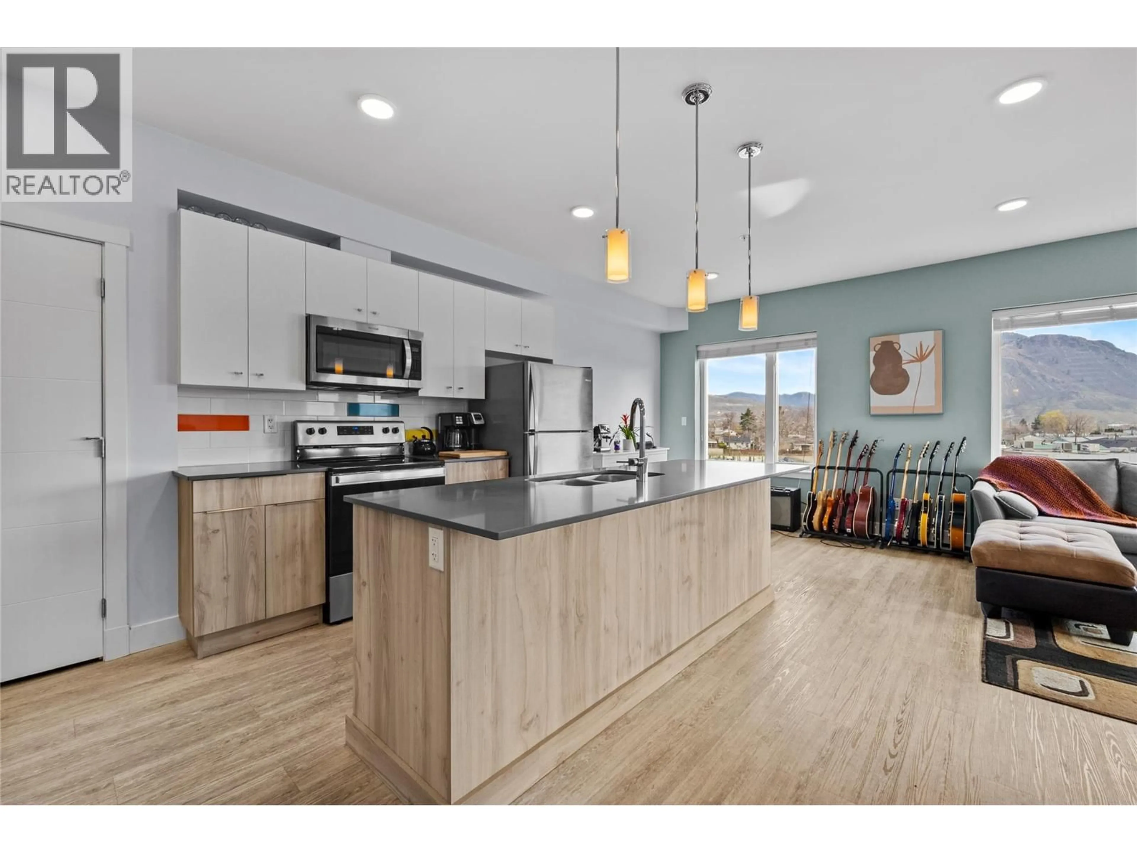 Open concept kitchen, wood/laminate floor for 505 - 107 YEW STREET, Kamloops British Columbia V2B4A1