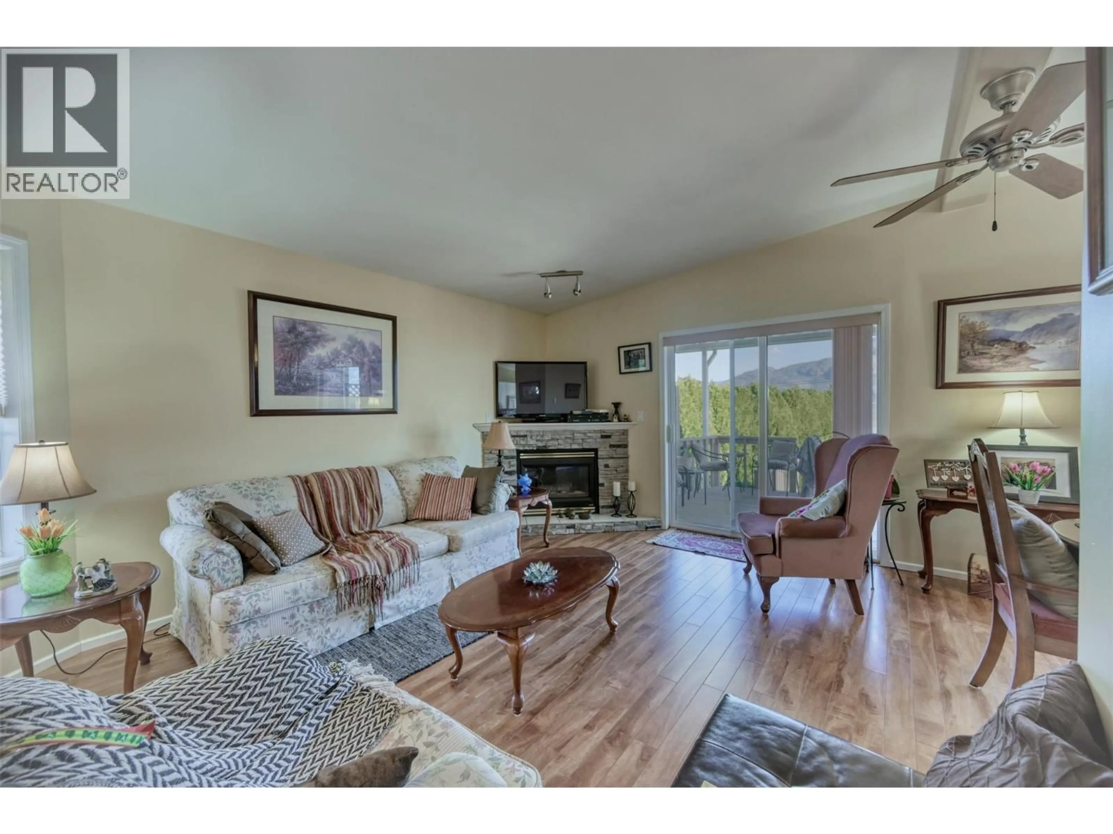 Living room with furniture, wood/laminate floor for 14 - 9400 115TH STREET, Osoyoos British Columbia V0H1V5