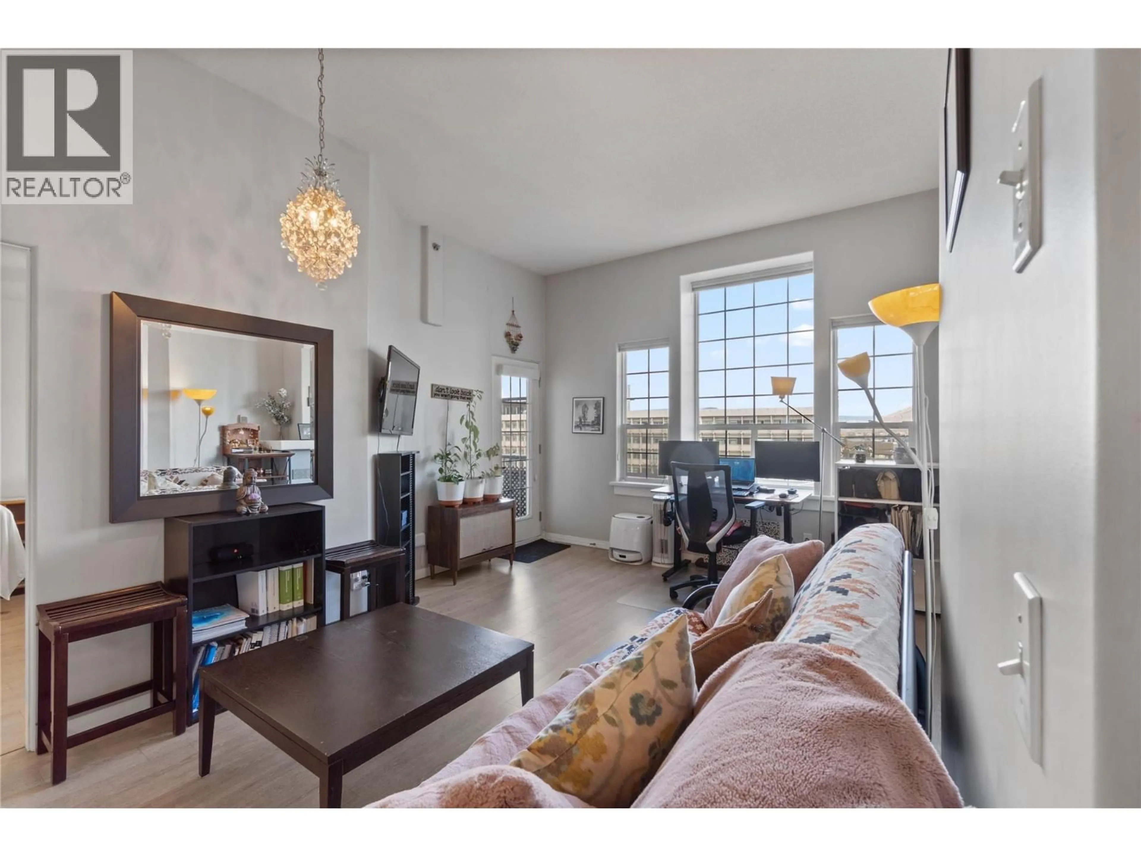 Living room with furniture, wood/laminate floor for 417 - 554 SEYMOUR STREET, Kamloops British Columbia V2C2E5