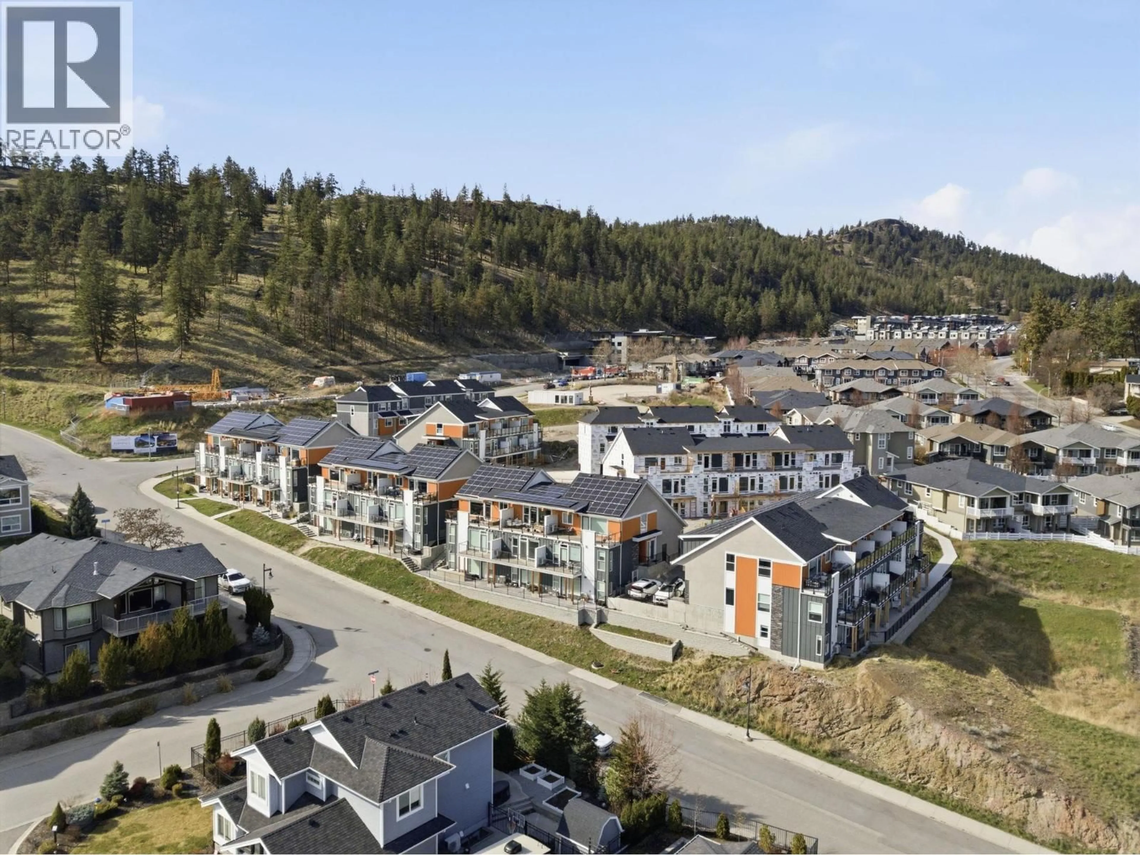 A pic from outside/outdoor area/front of a property/back of a property/a pic from drone, mountain view for 71 - 685 BOYNTON PLACE, Kelowna British Columbia V1V2Y2