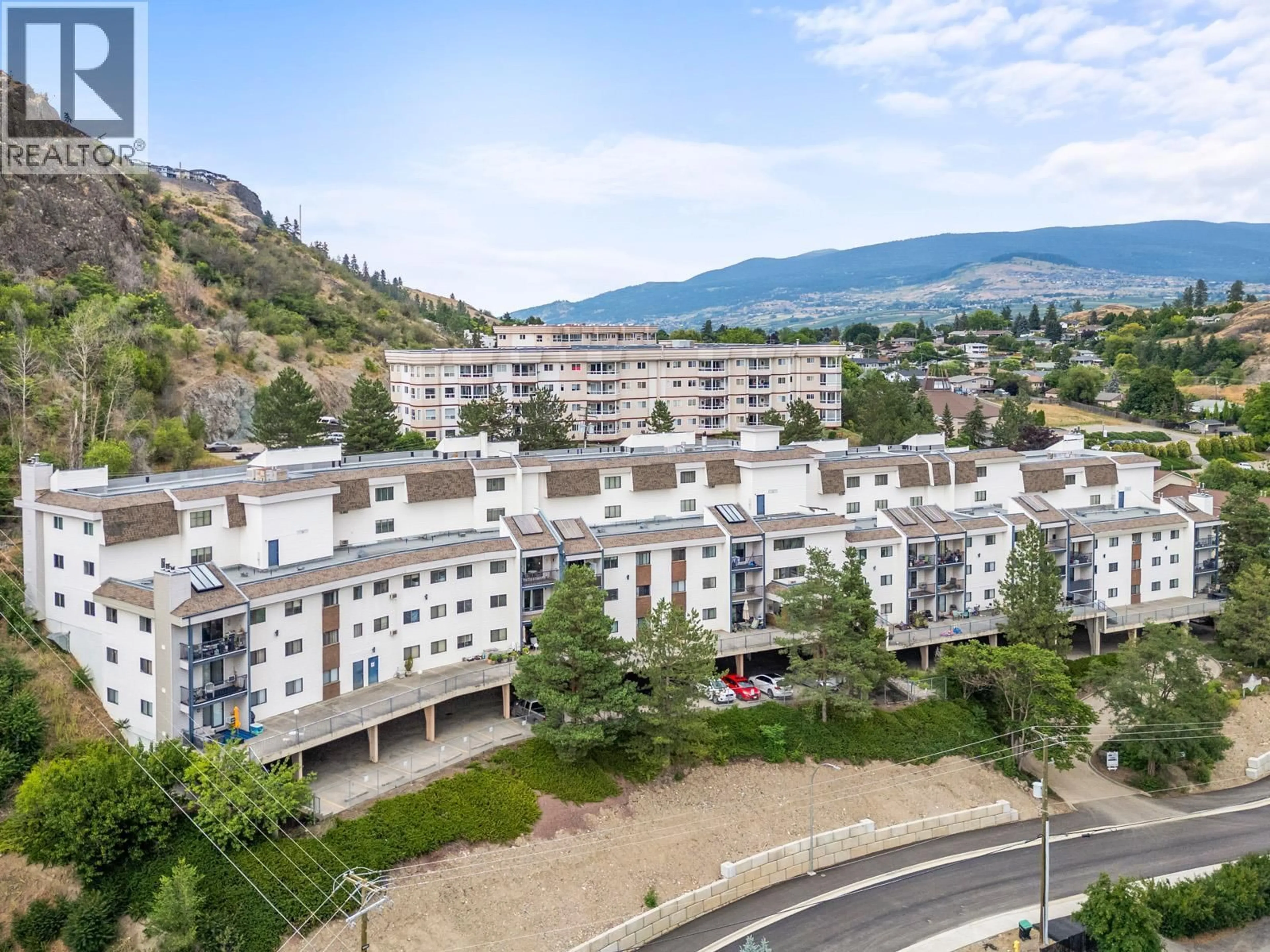 A pic from outside/outdoor area/front of a property/back of a property/a pic from drone, mountain view for 524 - 3901 32 AVENUE, Vernon British Columbia V1T8M3