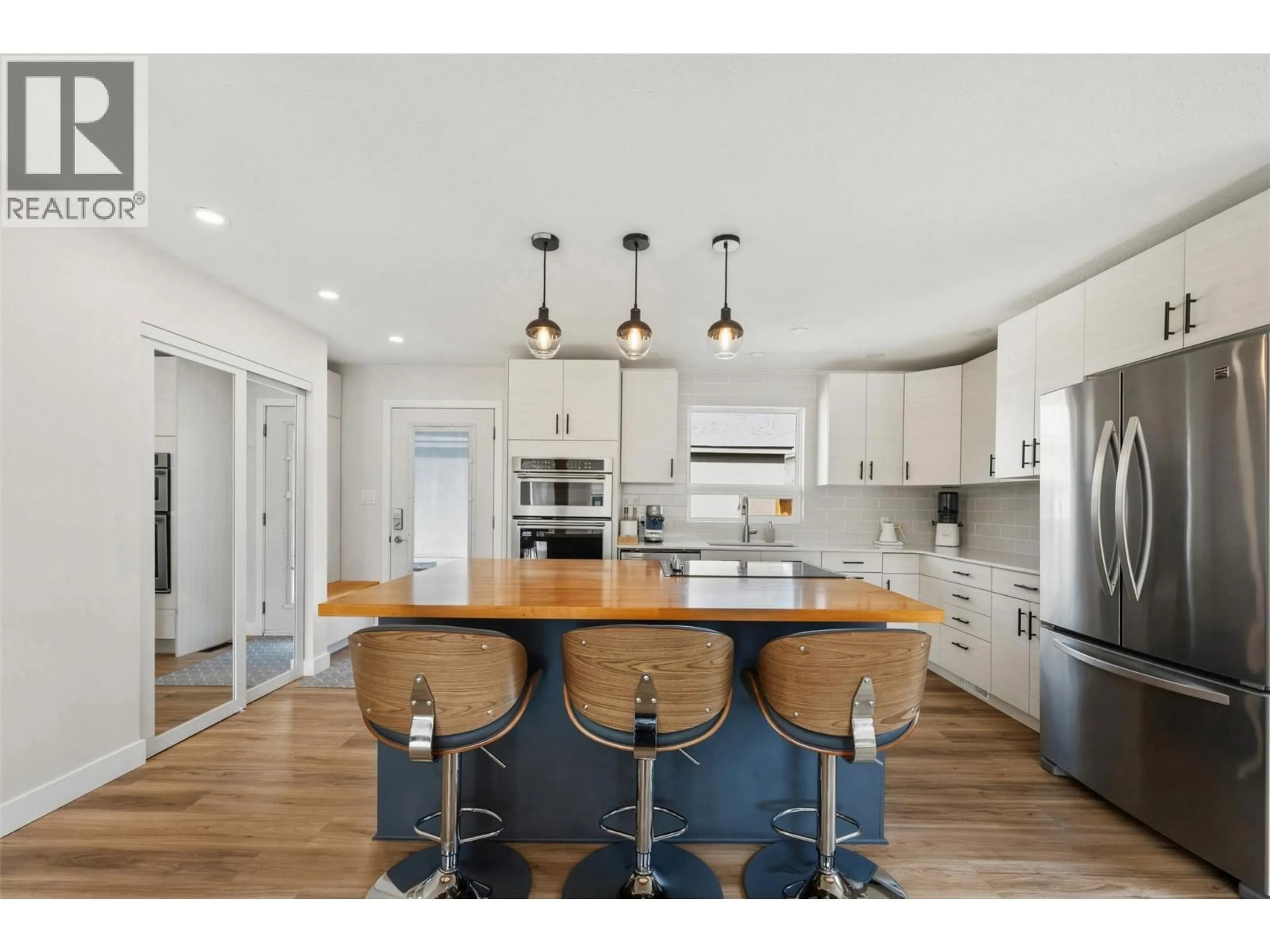 Open concept kitchen, wood/laminate floor for 35 GRANBY AVENUE, Penticton British Columbia V2A2Y6