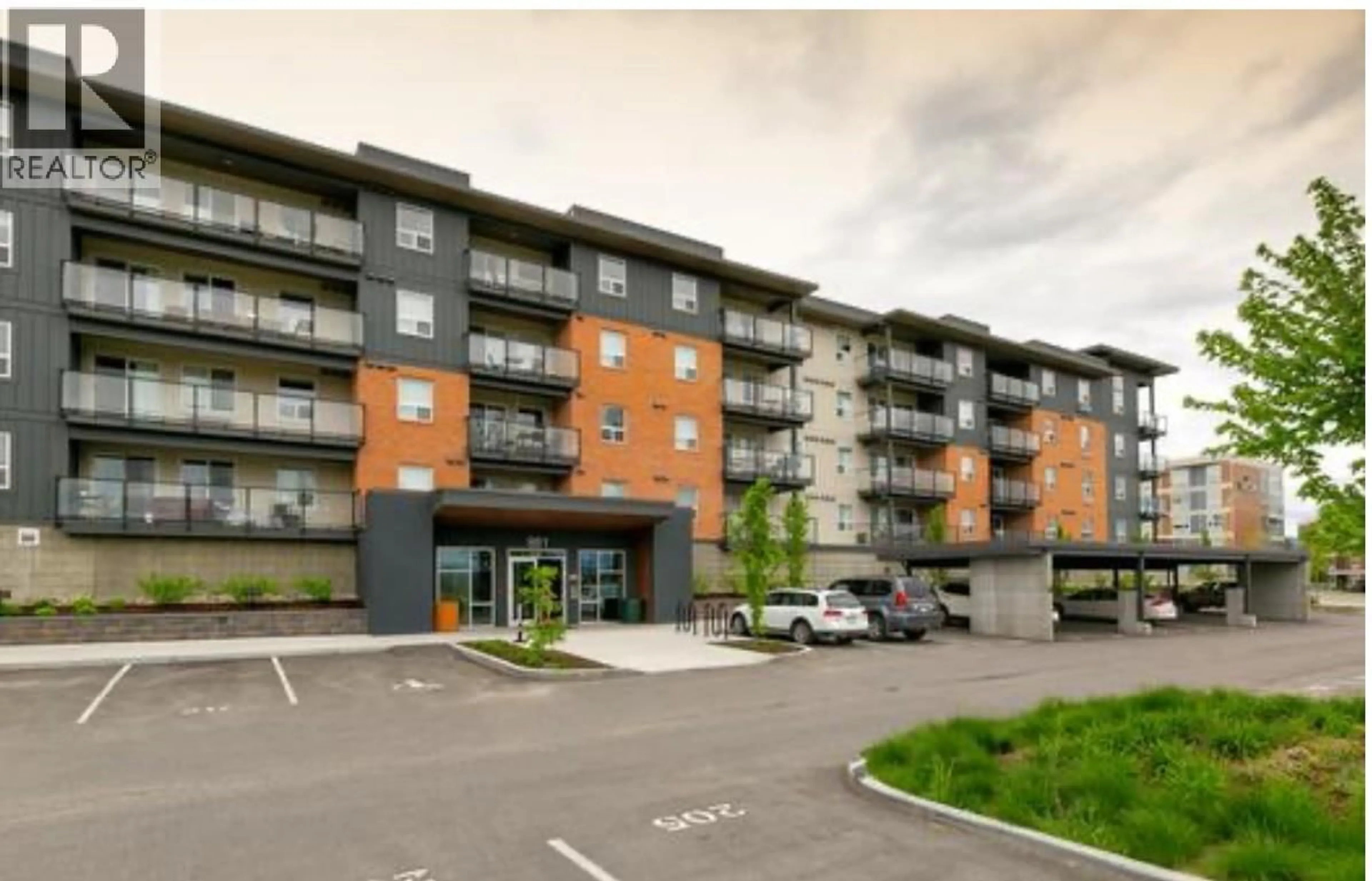 A pic from outside/outdoor area/front of a property/back of a property/a pic from drone, building for PH12 - 883 ACADEMY WAY, Kelowna British Columbia V1V0A3