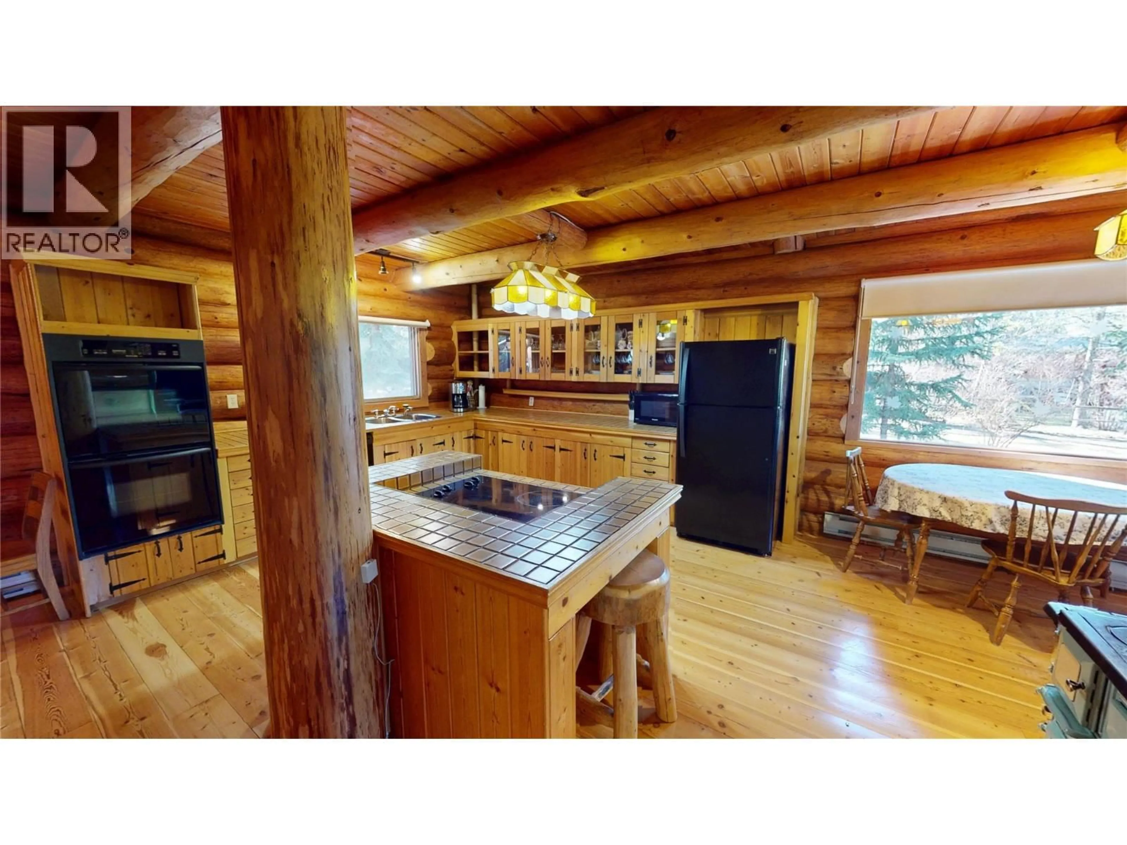Rustic kitchen, wood/laminate floor for 4892 OGILVEY AVENUE, Fairmont Hot Springs British Columbia V0A1L1