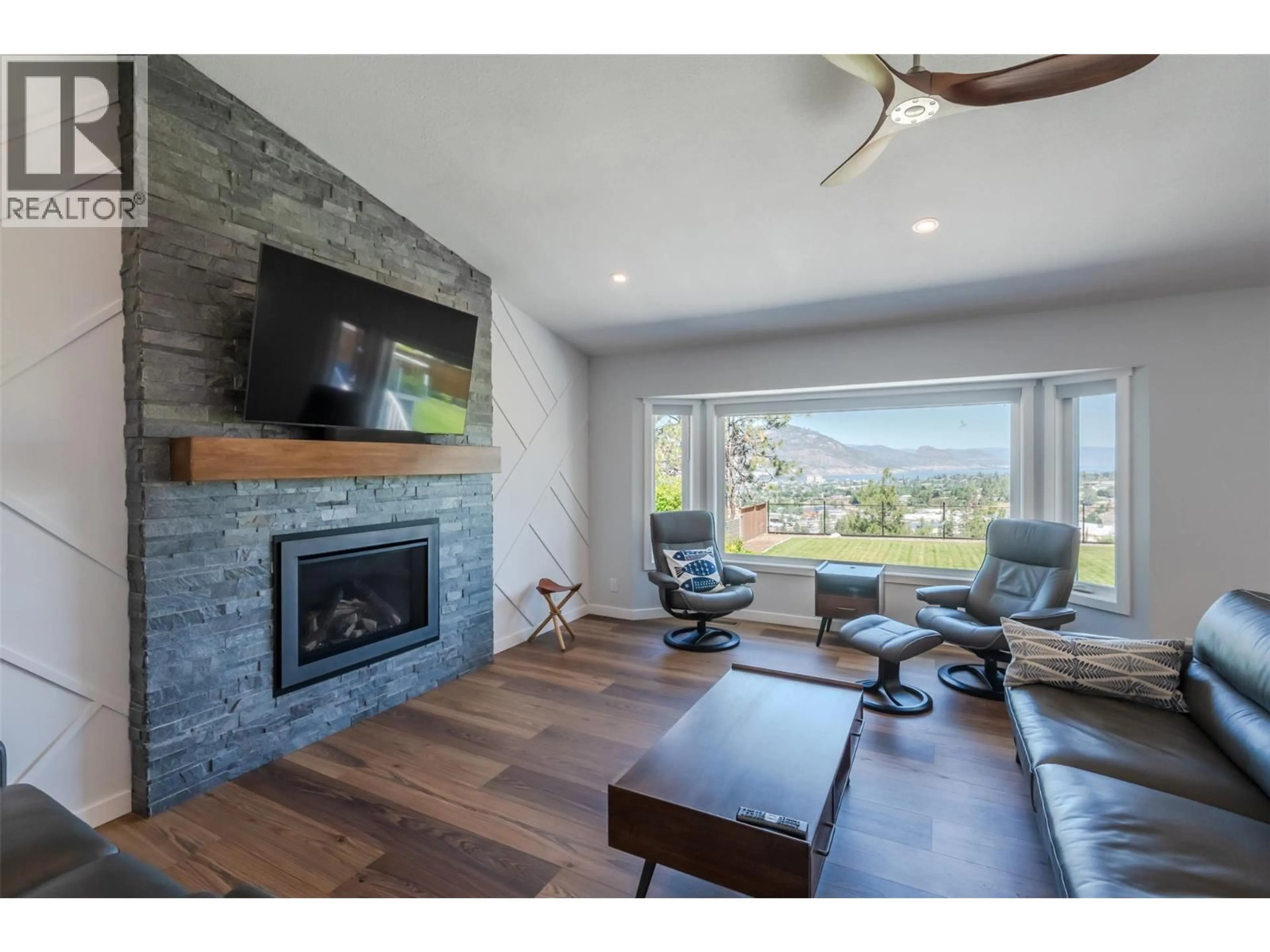 Living room with furniture, wood/laminate floor for 153 WESTVIEW DRIVE, Penticton British Columbia V2A7V9