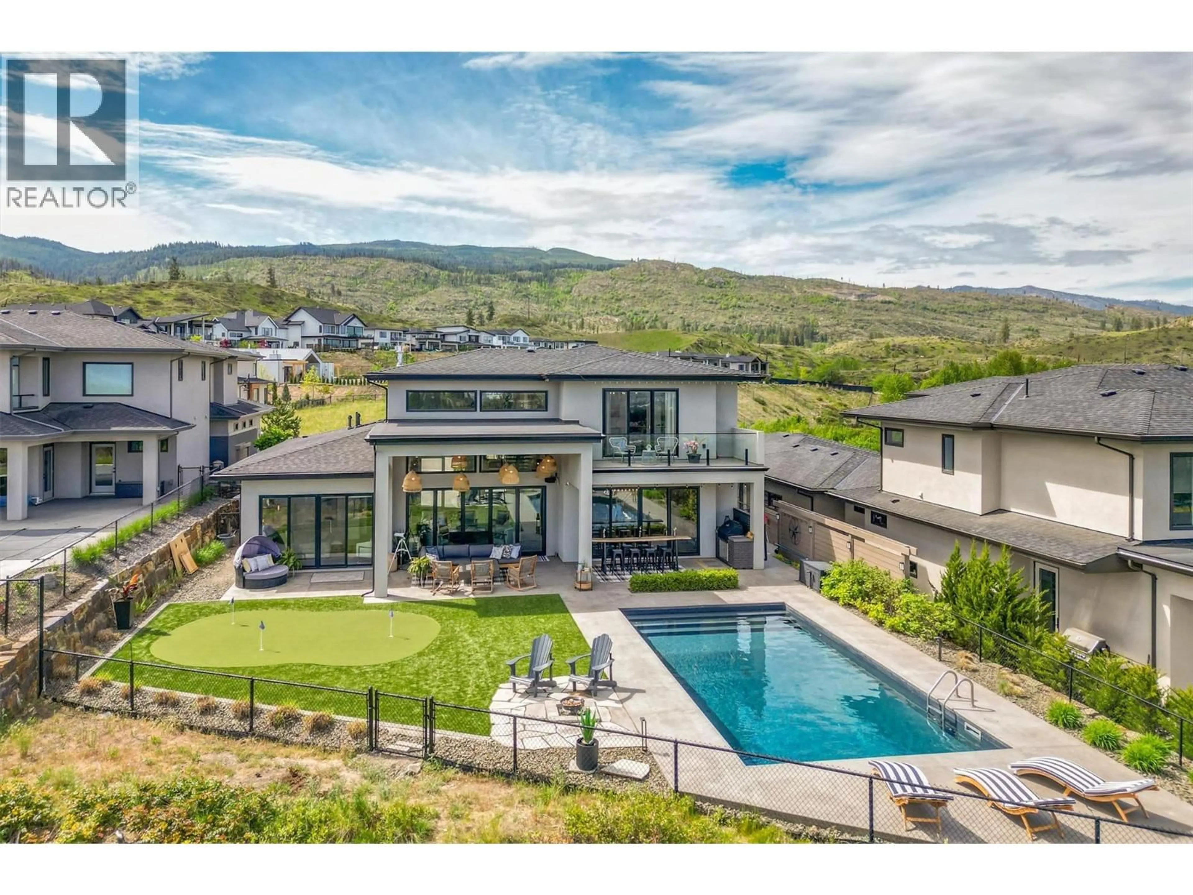 A pic from outside/outdoor area/front of a property/back of a property/a pic from drone, mountain view for 1612 VINCENT PLACE, Kelowna British Columbia V1W5N9
