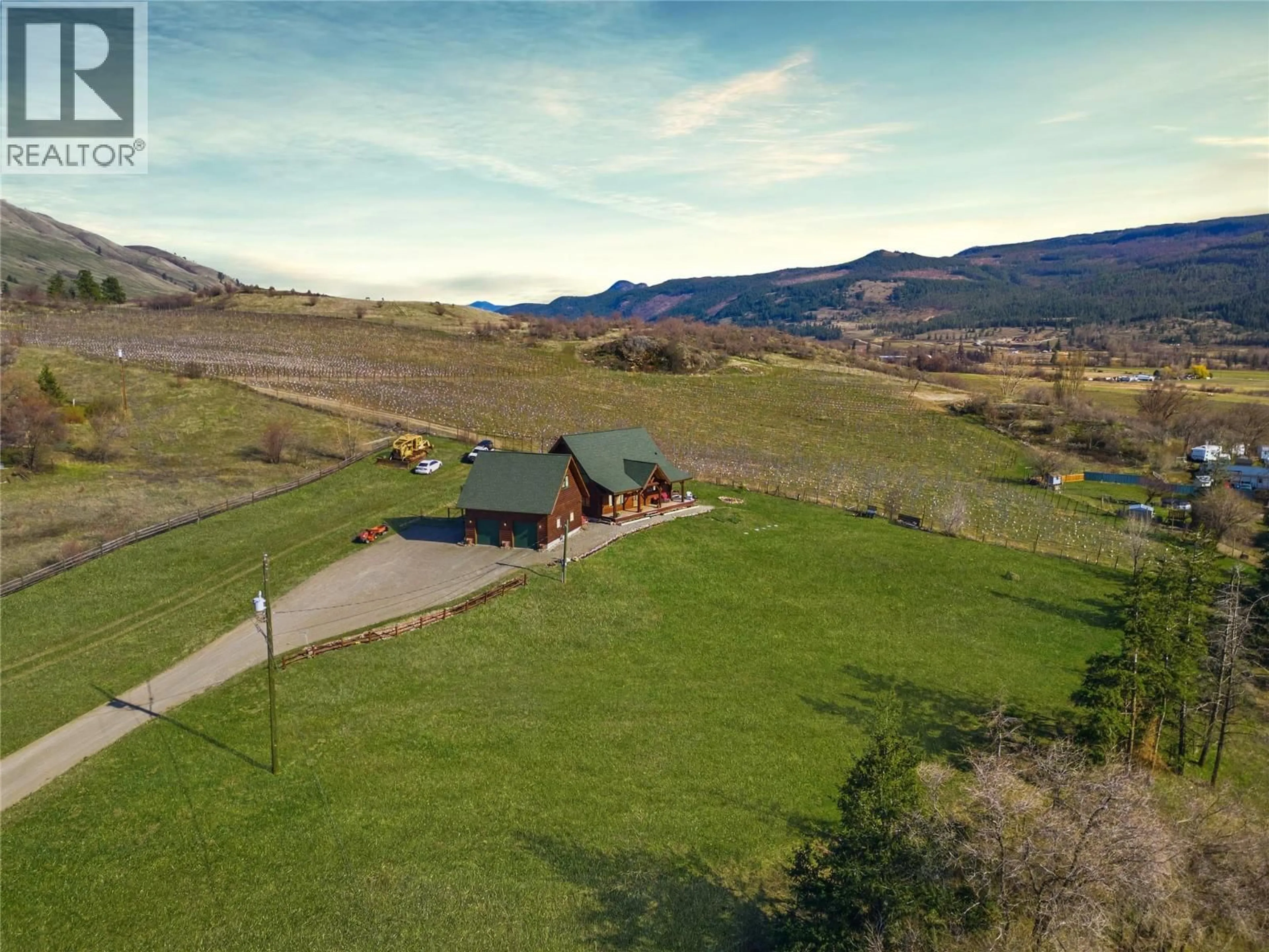 A pic from outside/outdoor area/front of a property/back of a property/a pic from drone, mountain view for 9371 6 HIGHWAY, Coldstream British Columbia V1B3B5