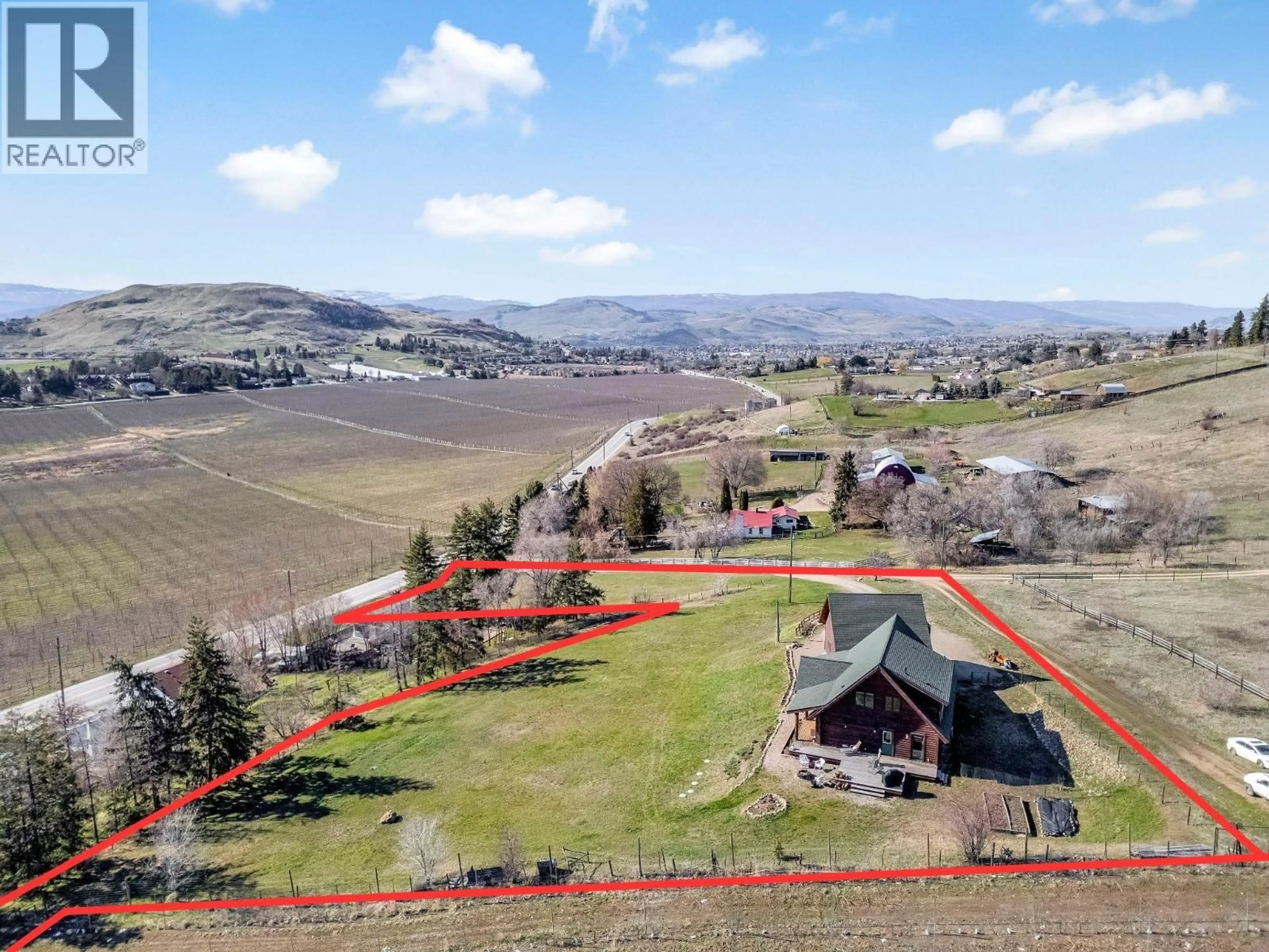 A pic from outside/outdoor area/front of a property/back of a property/a pic from drone, mountain view for 9371 6 HIGHWAY, Coldstream British Columbia V1B3B5