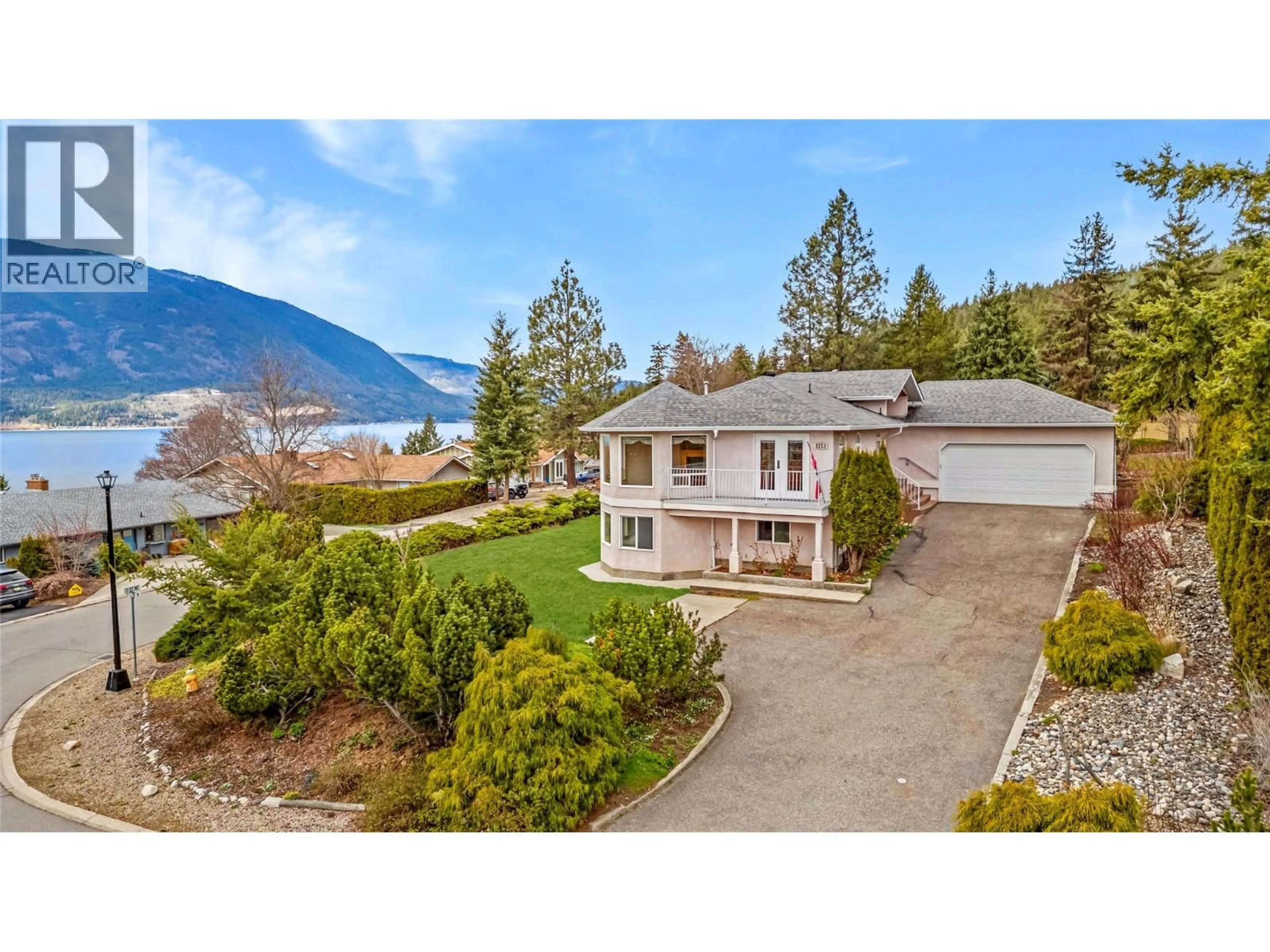 A pic from outside/outdoor area/front of a property/back of a property/a pic from drone, mountain view for 1131 50 AVENUE NORTHEAST, Salmon Arm British Columbia V1E3N1
