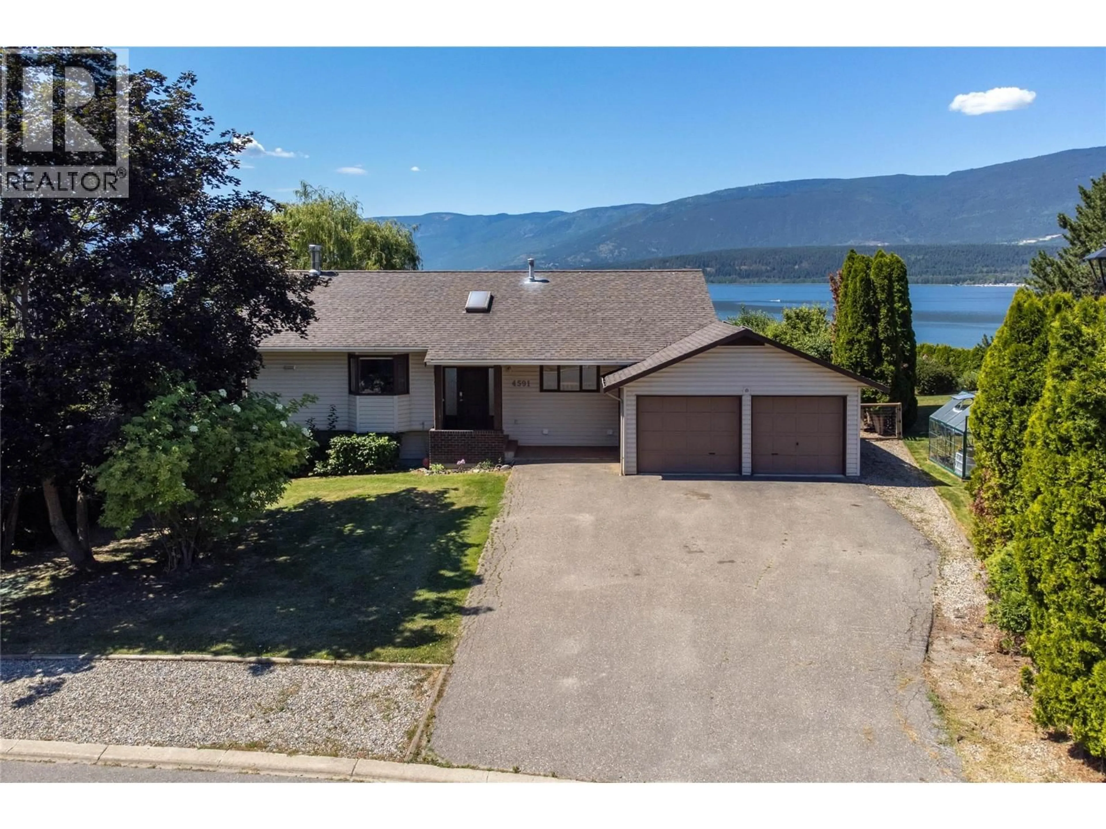 A pic from outside/outdoor area/front of a property/back of a property/a pic from drone, water/lake/river/ocean view for 4591 13 STREET NORTHEAST, Salmon Arm British Columbia V1E1E3