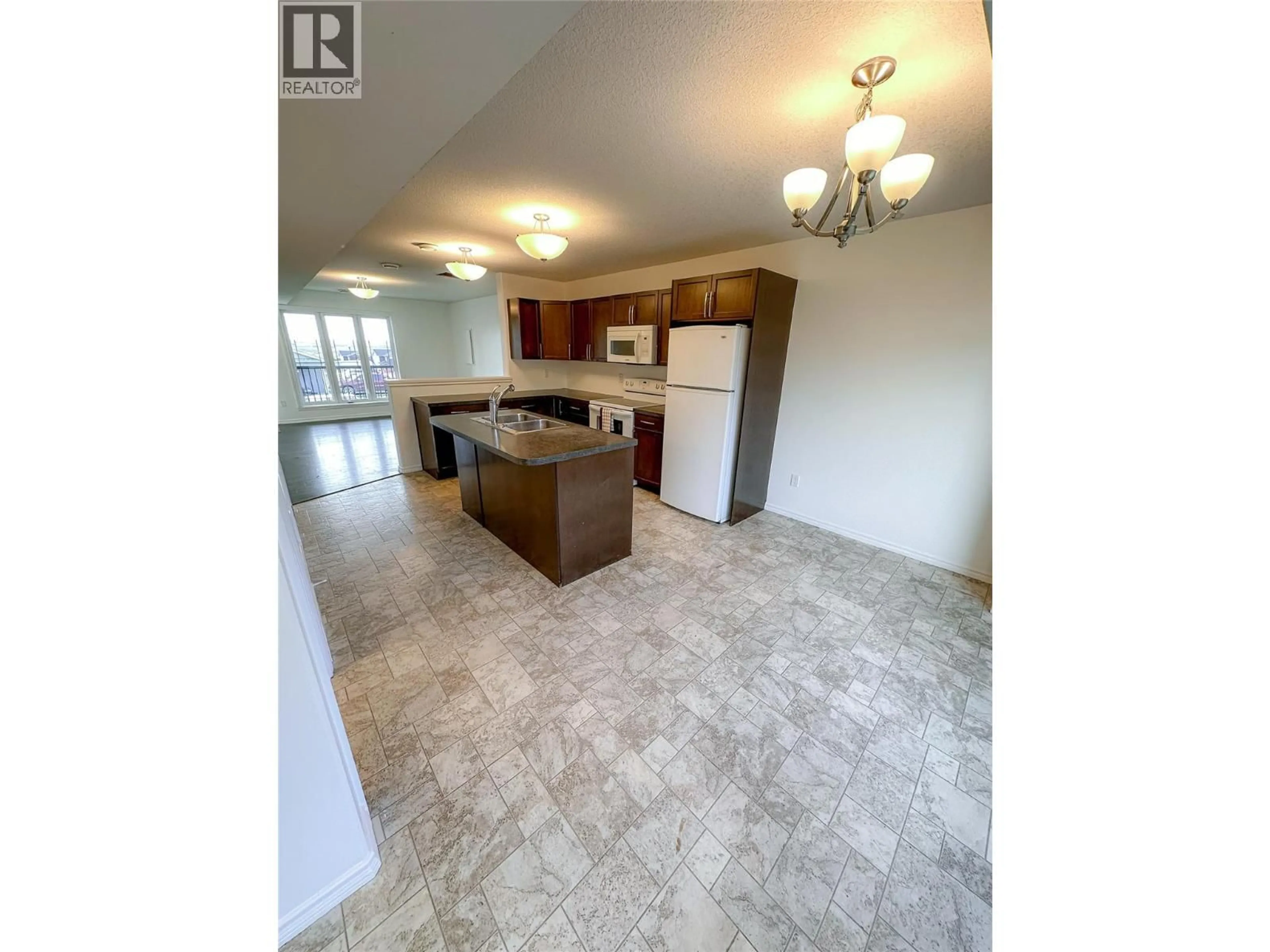 Open concept kitchen, ceramic/tile floor for 8300 17A STREET, Dawson Creek British Columbia V1G0E1